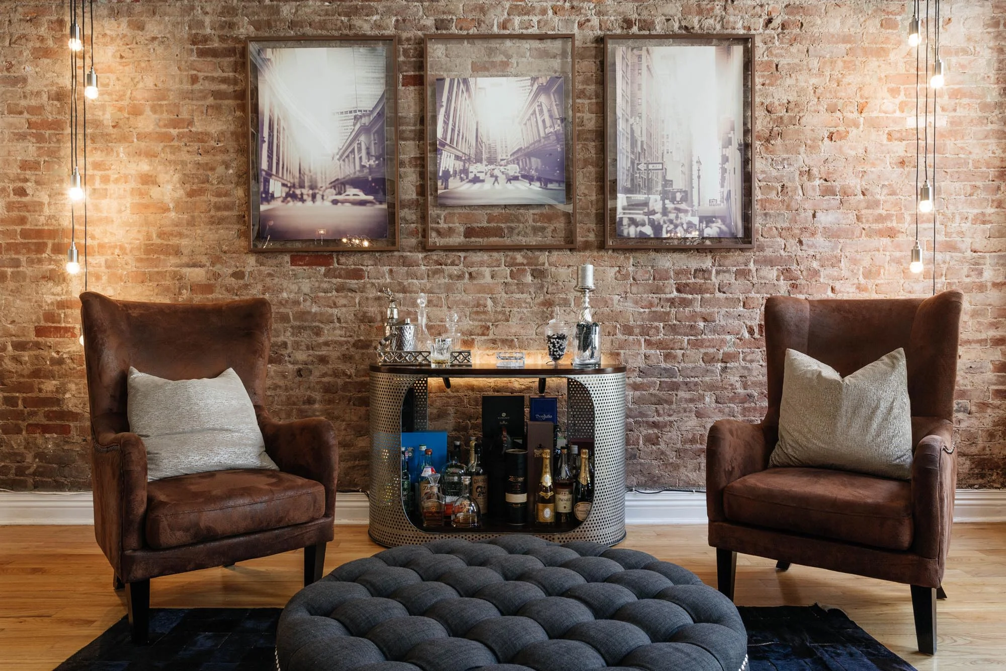 Sitting area with small bar and round ottoman