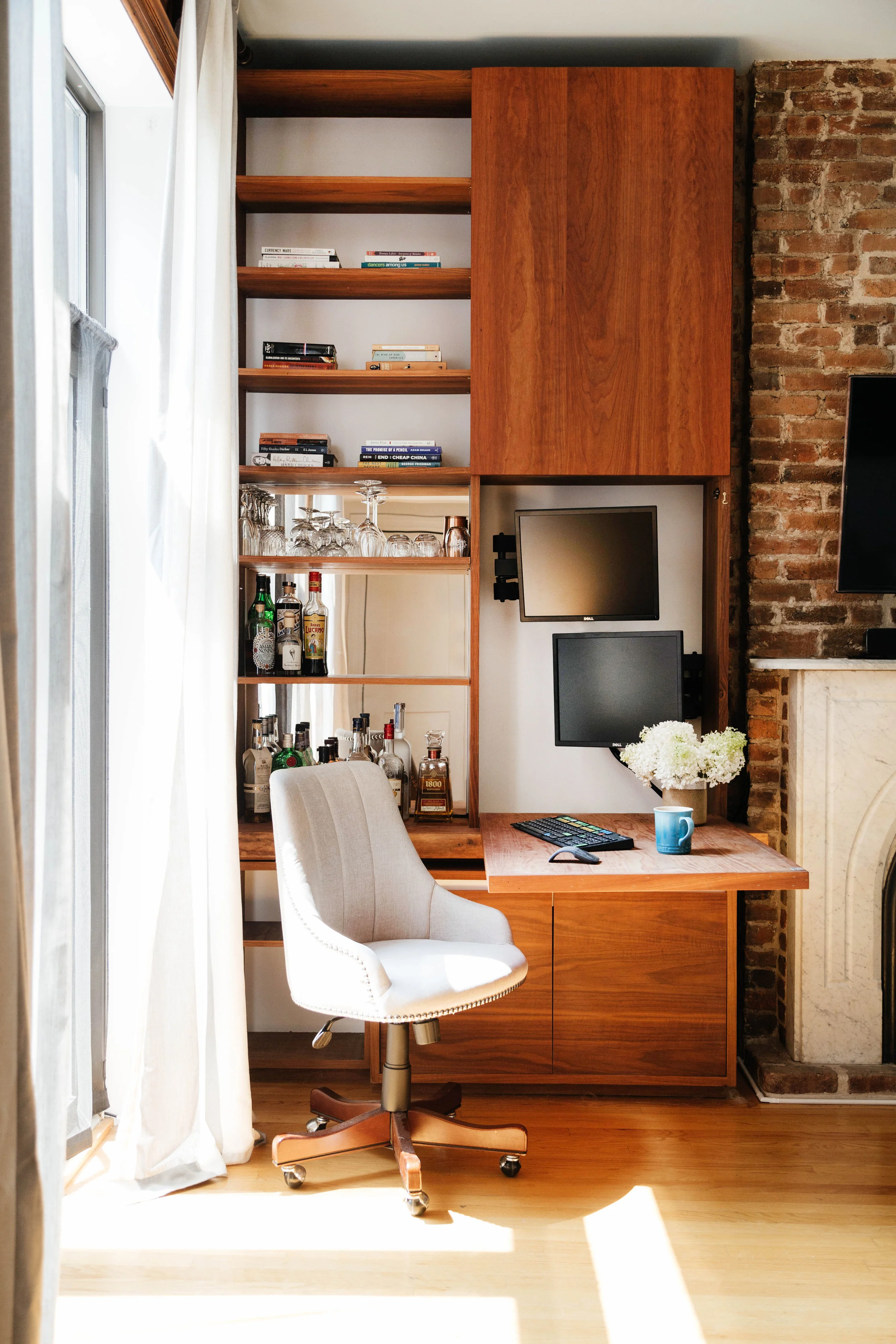 Tall wooden case with books