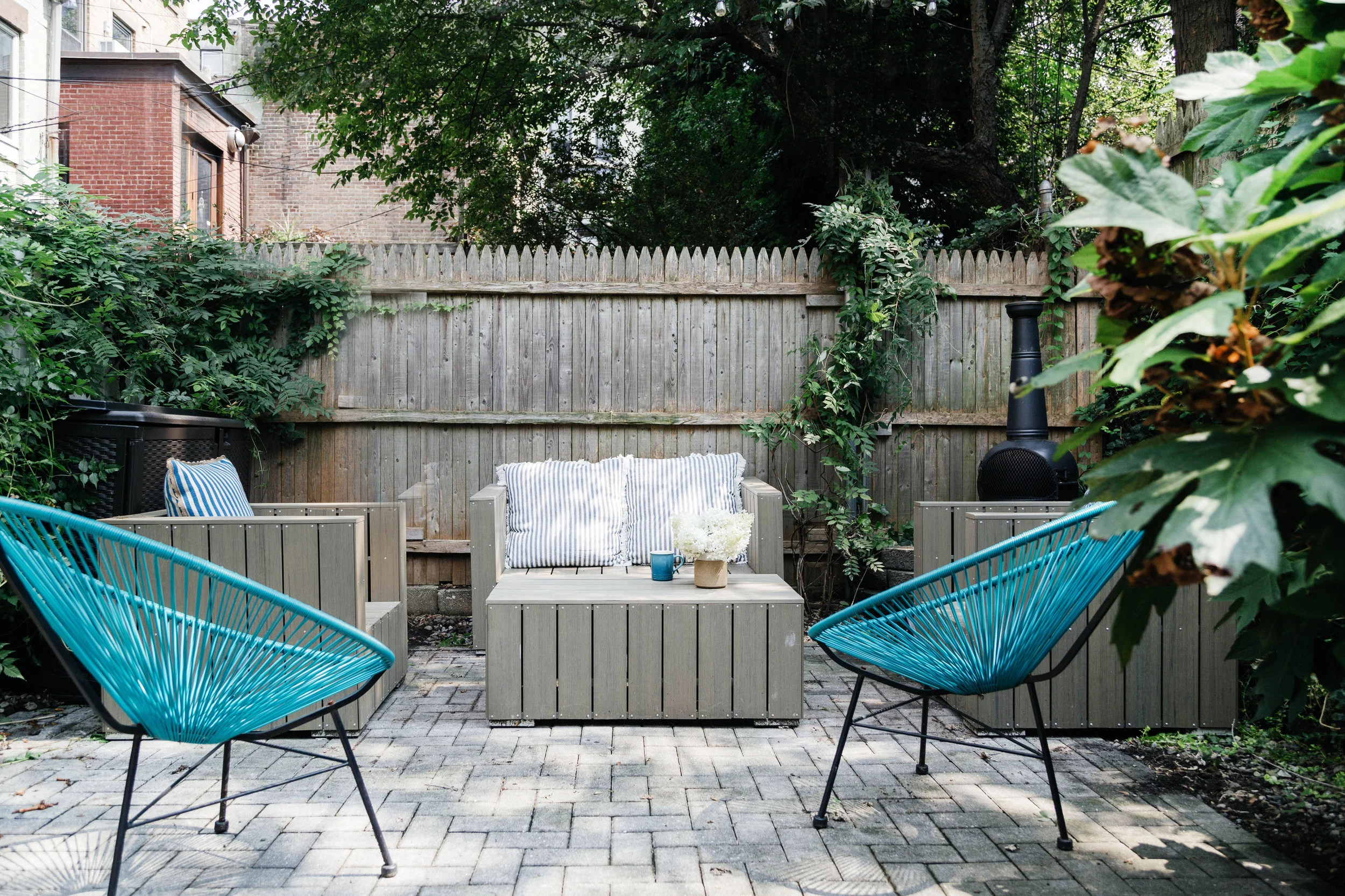 Outdoor seating area with blue chairs
