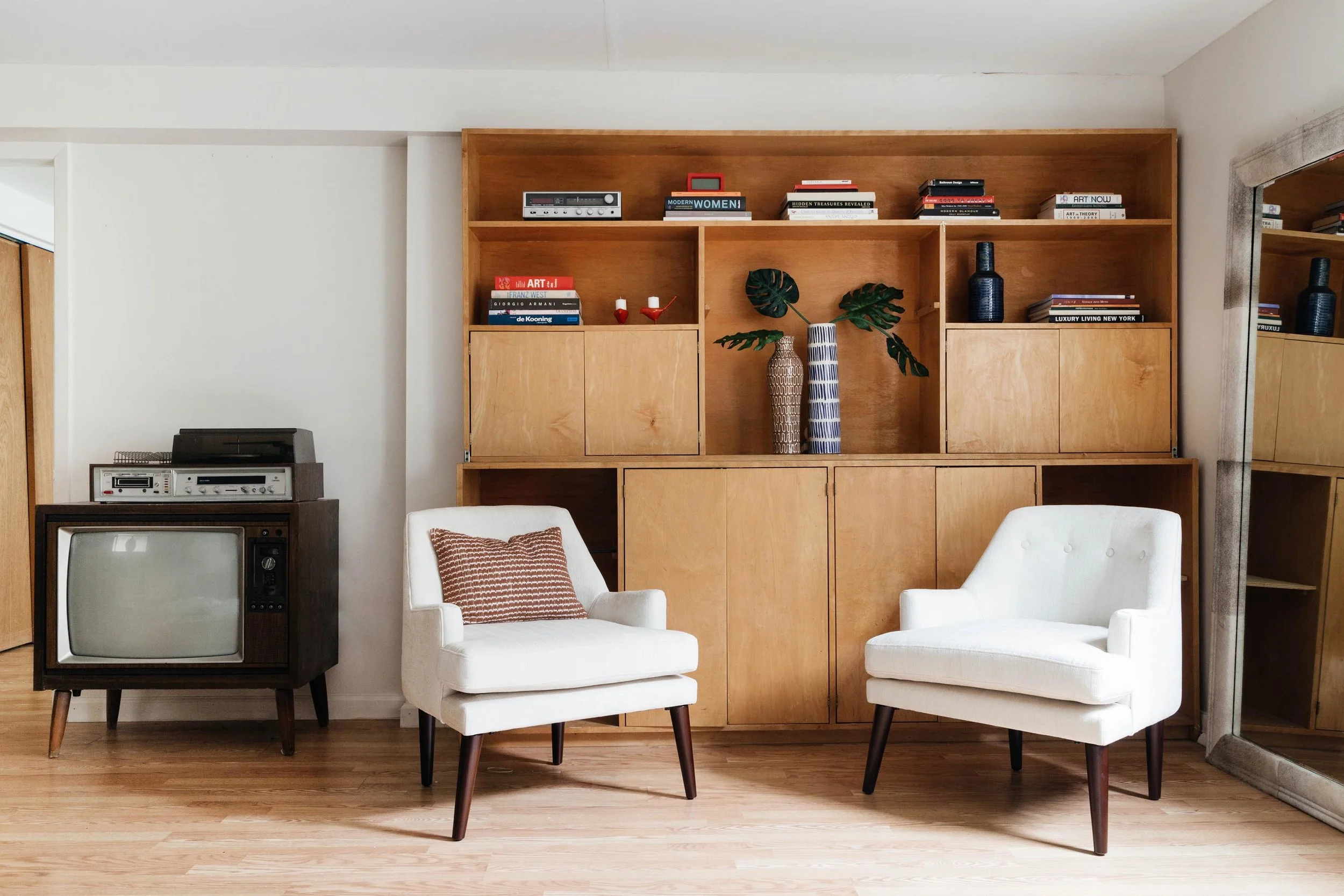 Custom wooden built in with two white chairs