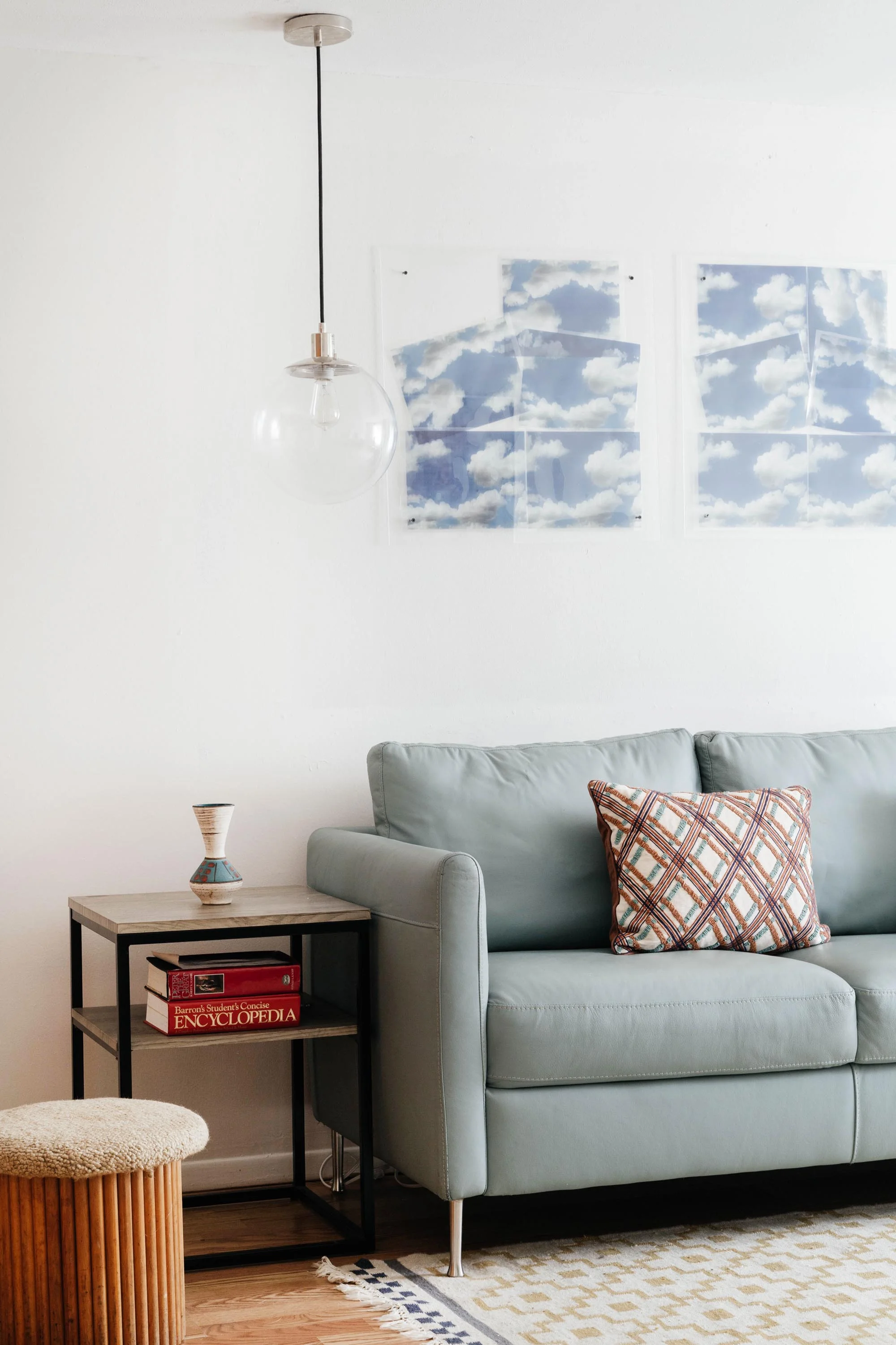 Corner of office area with pale blue sofa