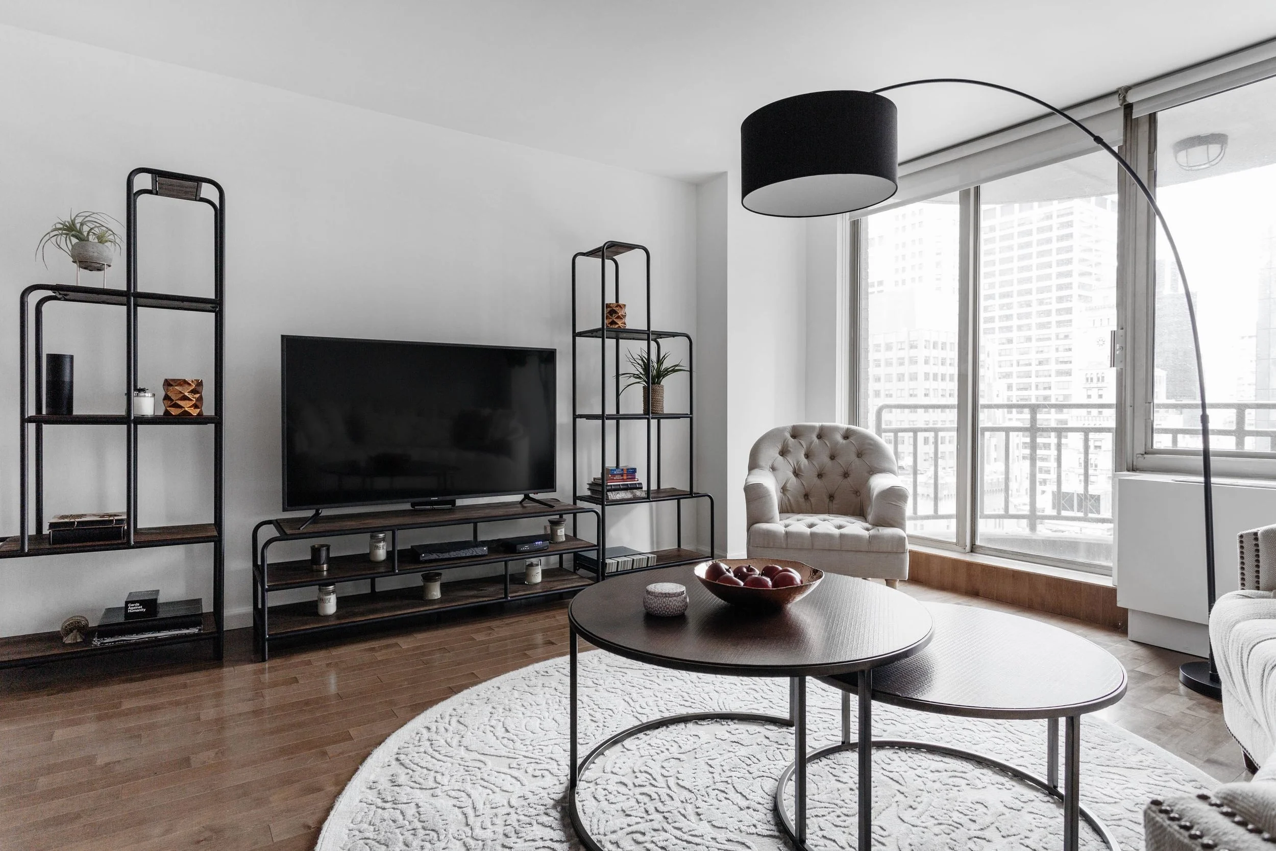 Living room area with black TV on stand