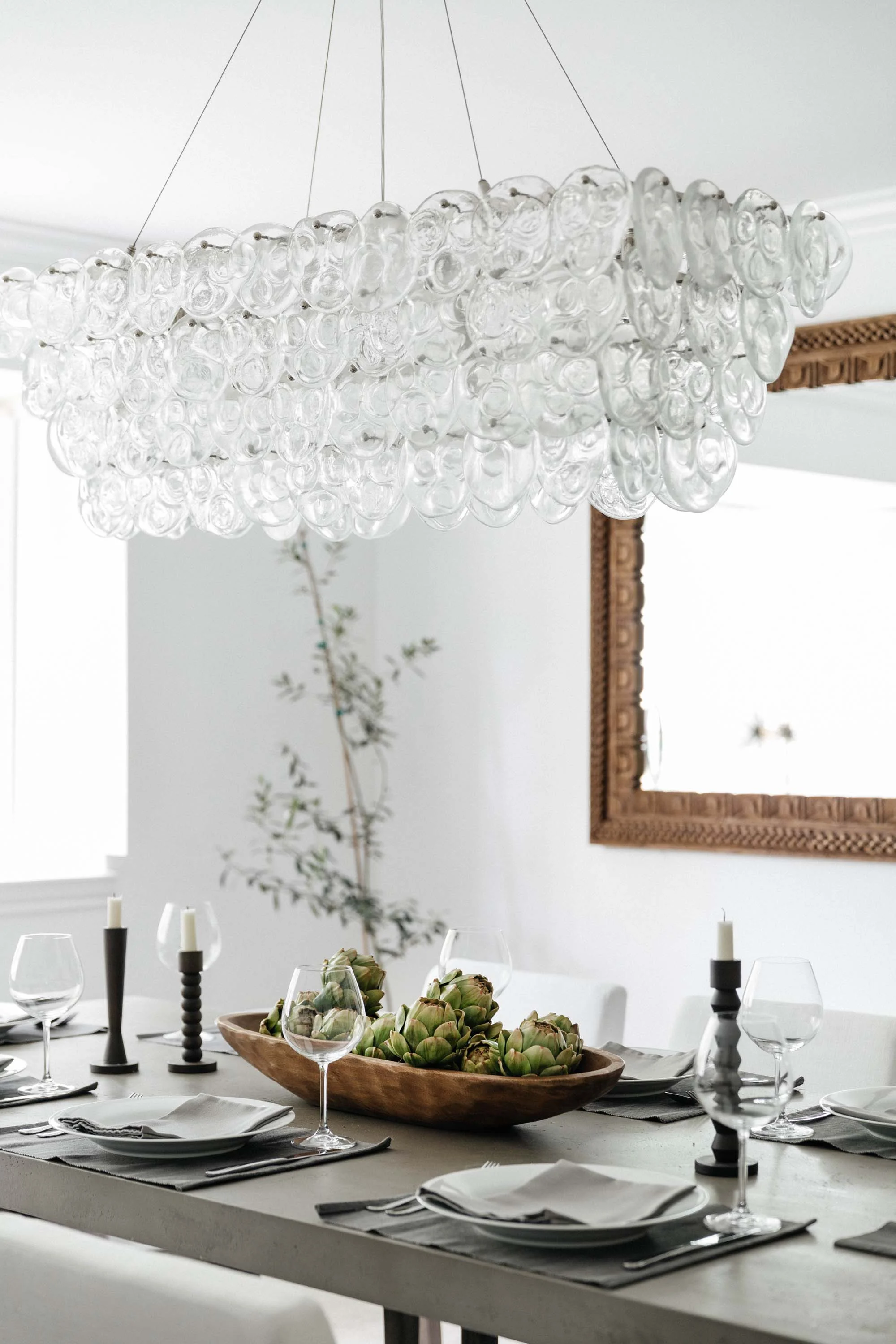 Dining room with dining table, chandelier and table setting