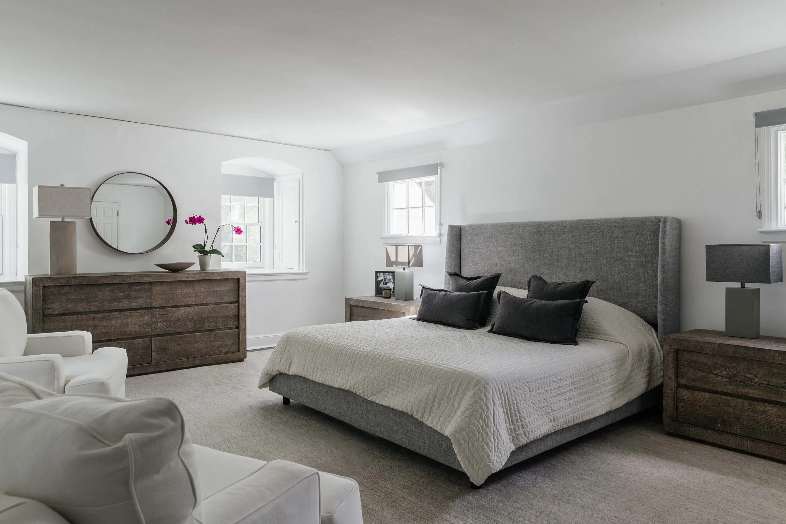 Modern bedroom with bed, bedside table and white painted walls