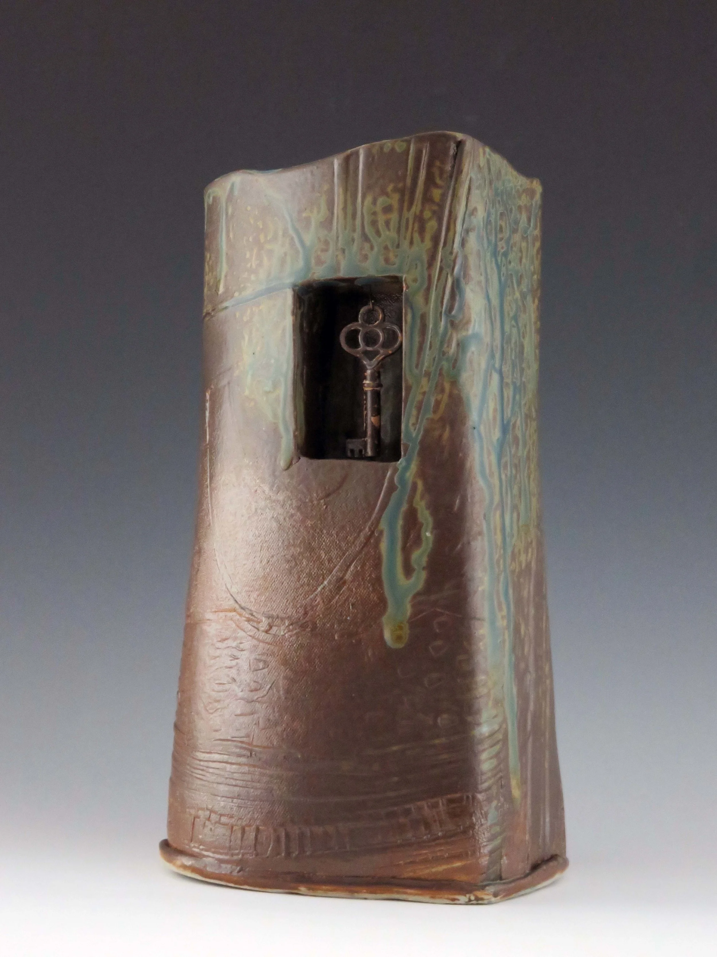 Hand built vessel with lock and key.jpg