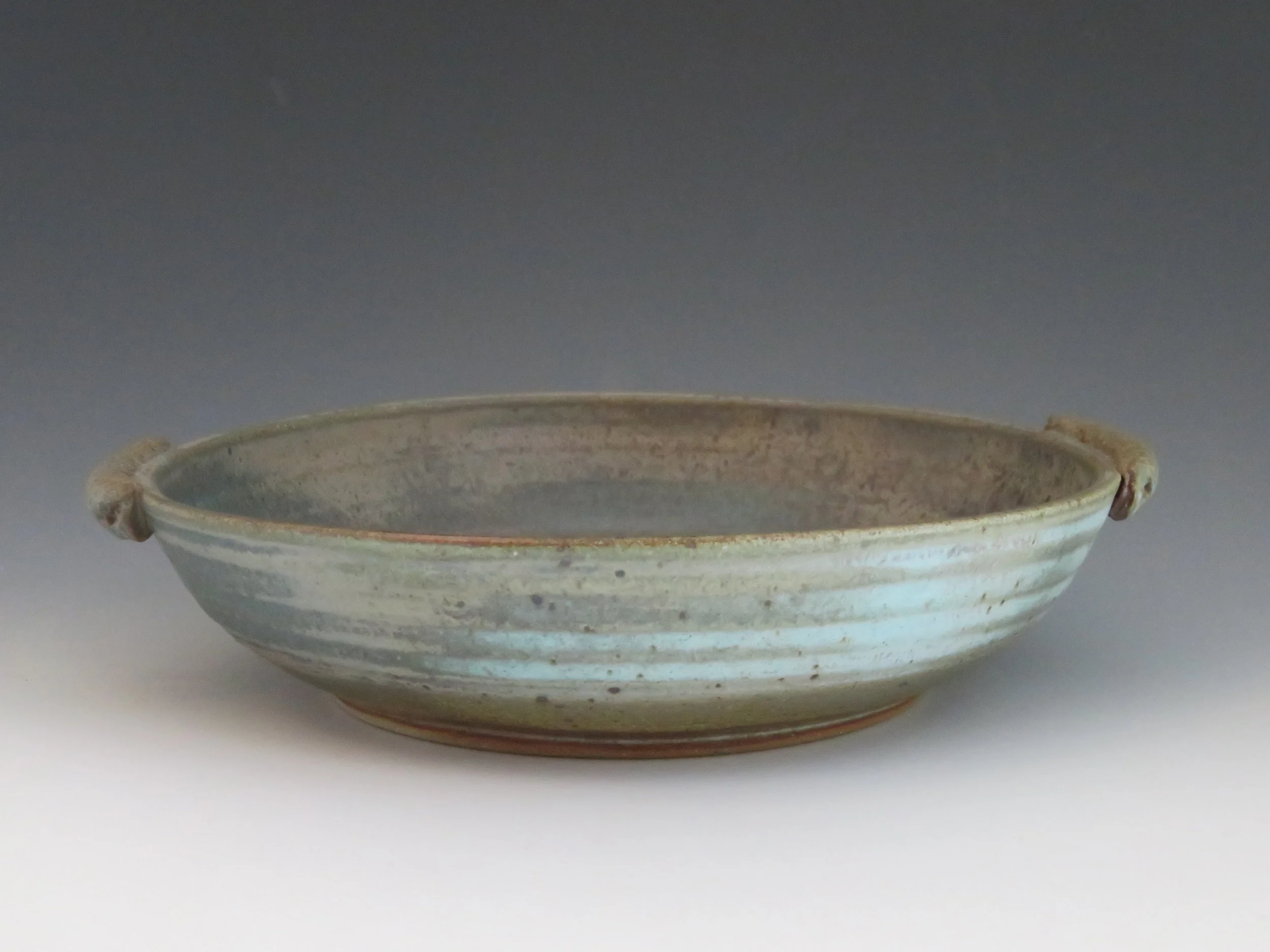 Shallow bowl, medium sized, turquoise glaze.