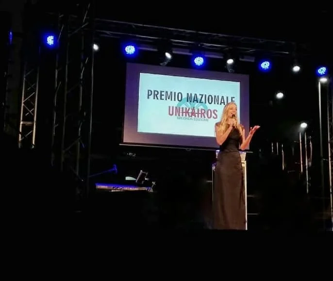 Jessica onstage for the Unikairos Association gala evening awards