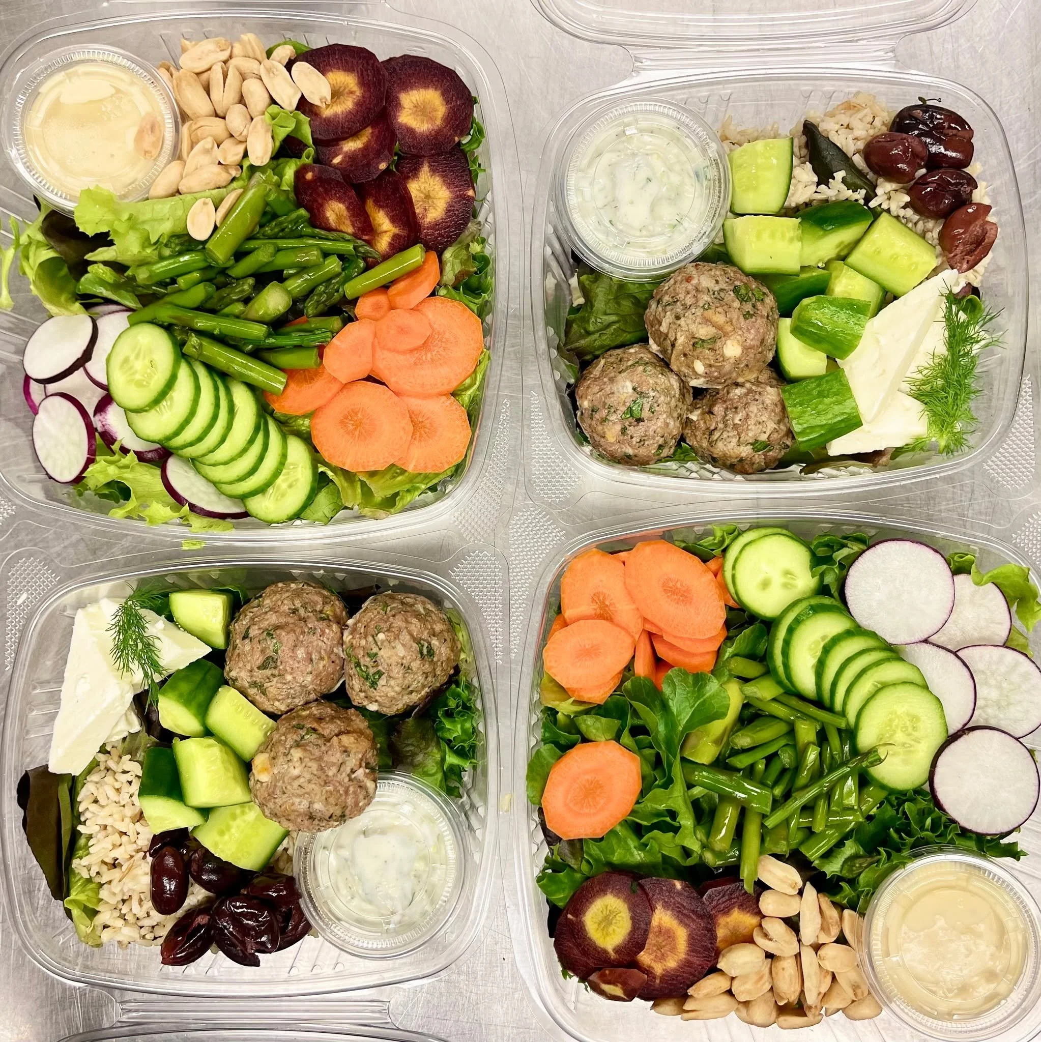 Greek Bounty Bowls - Spiced meatballs with brown rice, seasonal greens, cucumbers &amp; olives with a tzatziki dressing and Fresh Market Salads - Roasted beets along with sliced cucumbers, radishes, carrots and seasonal greens. Paired with a miso dre