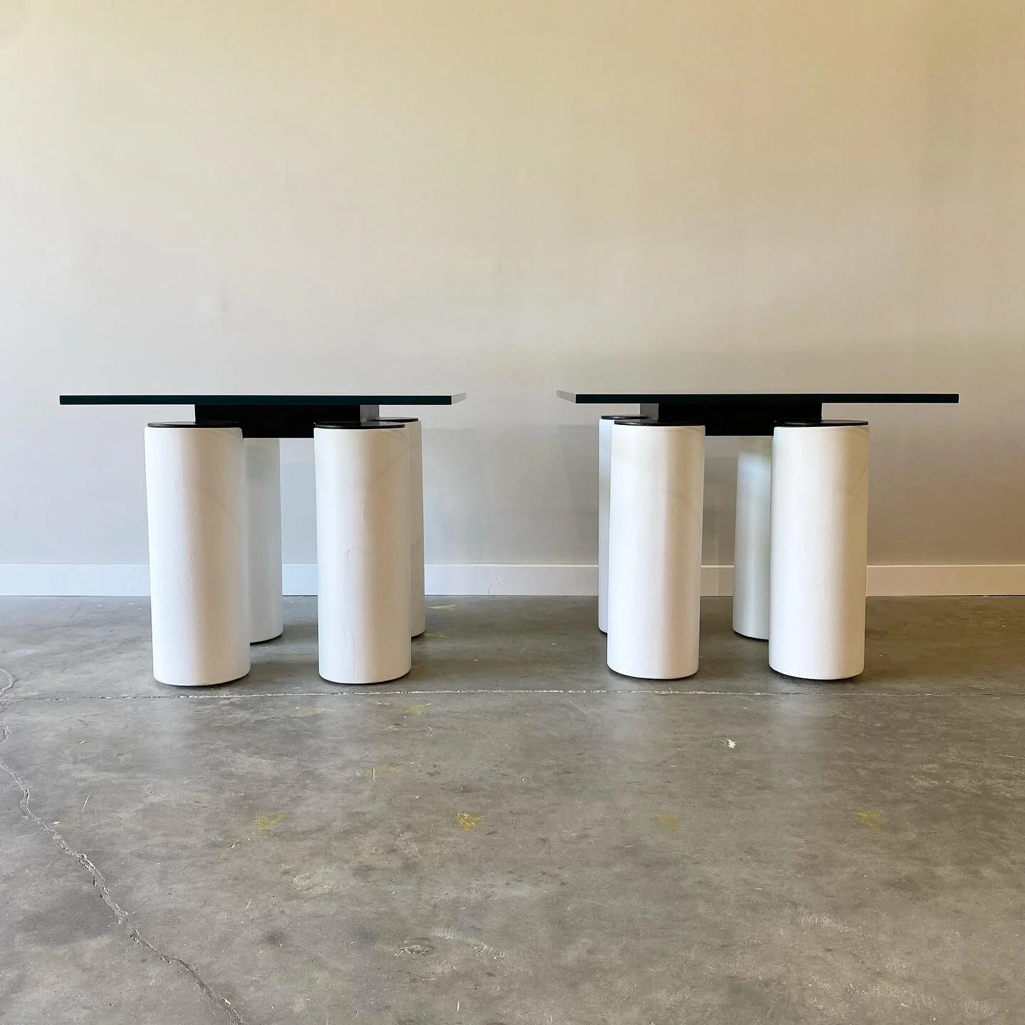 Exaggerated plaster columns with contrasting steel grid frame.  Raleigh post modern furniture