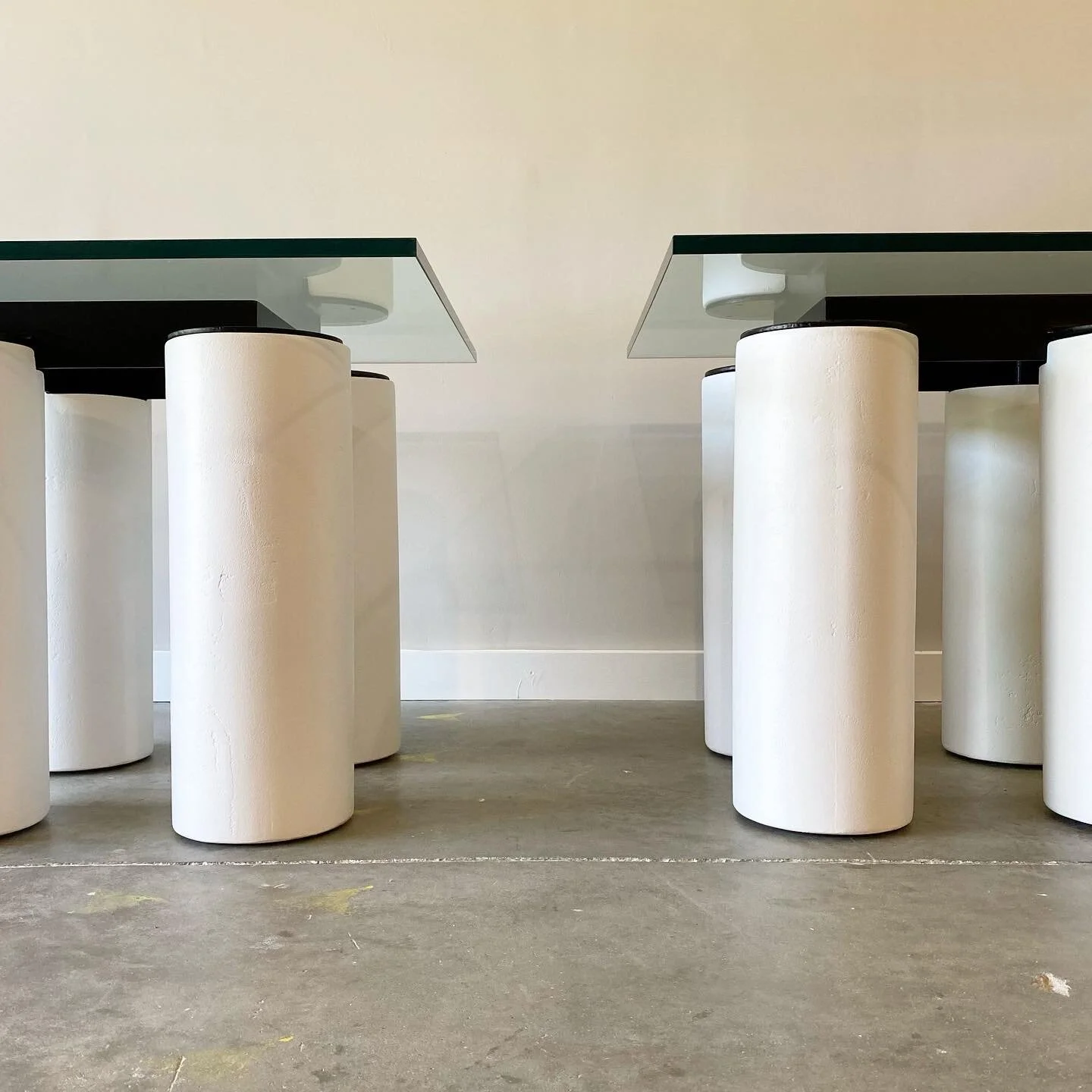 Post modern furniture in Raleigh. Exaggerated plaster columns with contrasting steel grid frame.