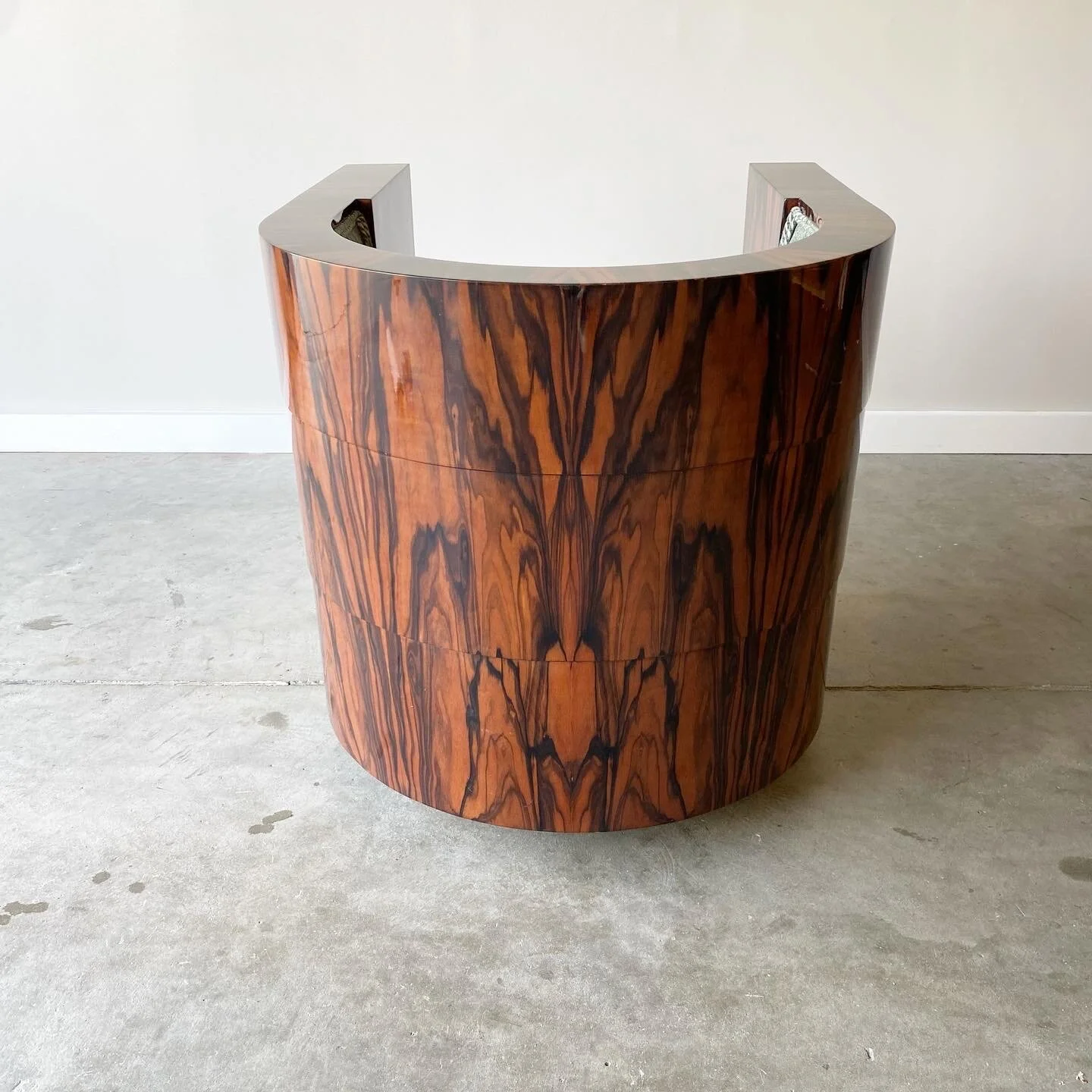 Back detail of A stunning vintage example newly upholstered. Striking Macassar ebony case with gloss lacquer finish. 1970s swivel chair from Pace Furniture.  