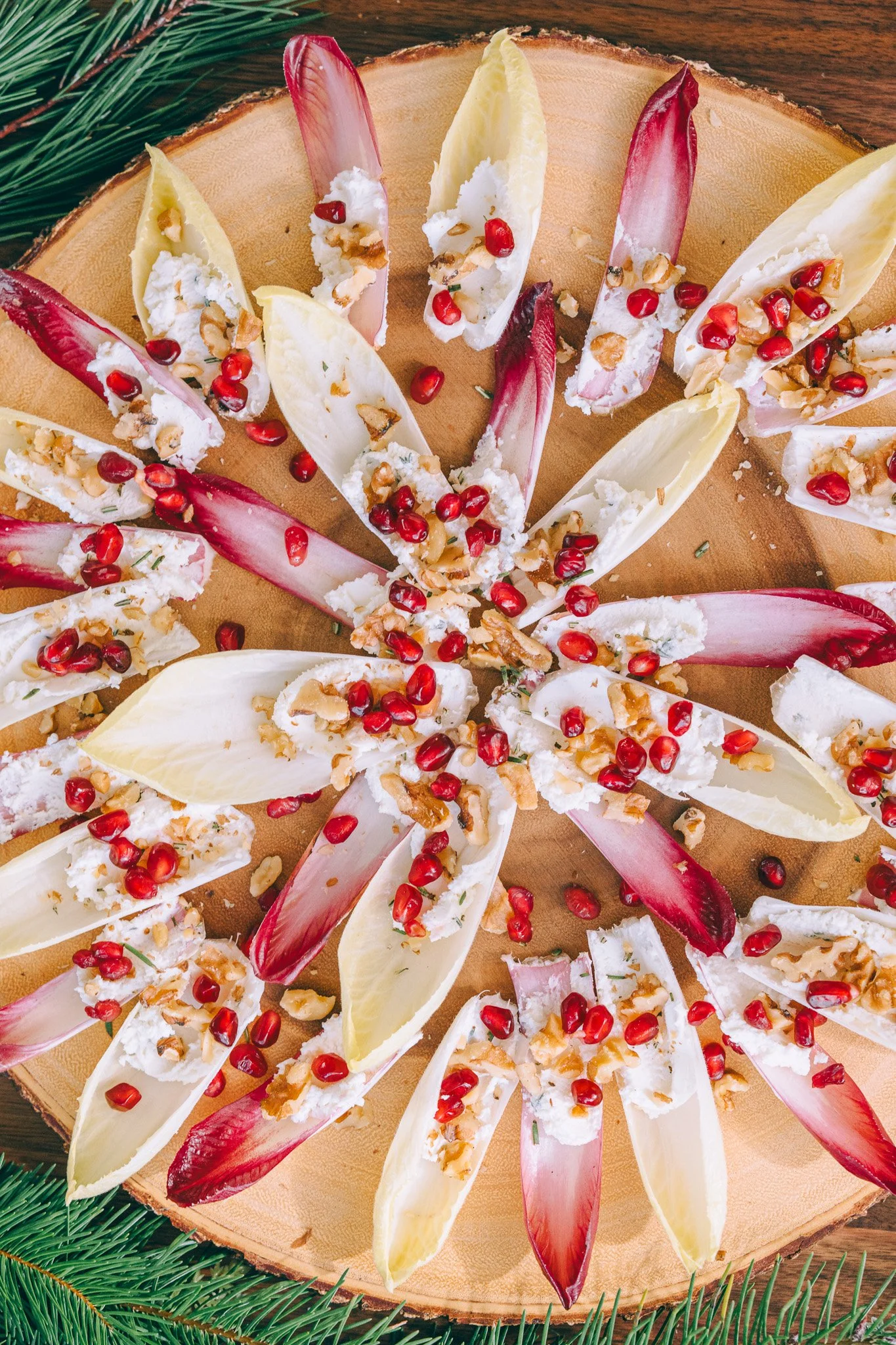 Pomegranate and Goat Cheese Endive Bites