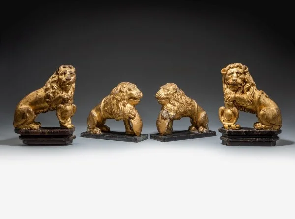 Two pairs of 17th century carved giltwood lions of great historical interest