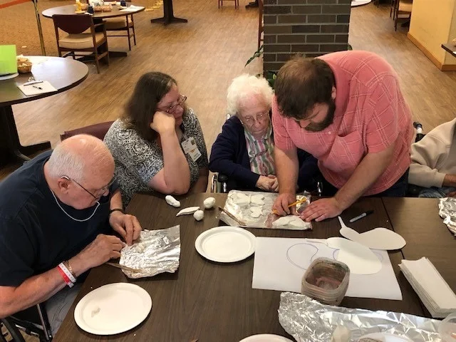 Drew Carriker demonstrates working in clay.