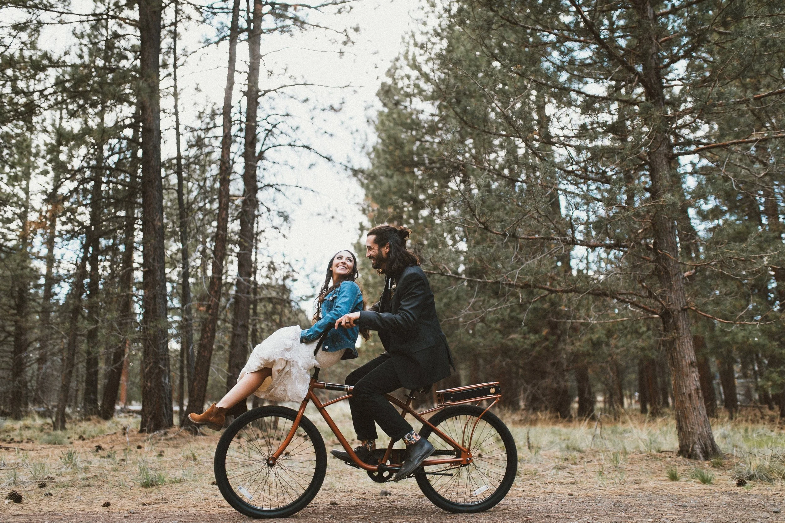 TONY-GAMBINO-BEND-OREGON-TRAVELING-WEDDING-PHOTOGRAPHER-FIVEPINE-LODGE_1400 bride and groom on bike.jpg