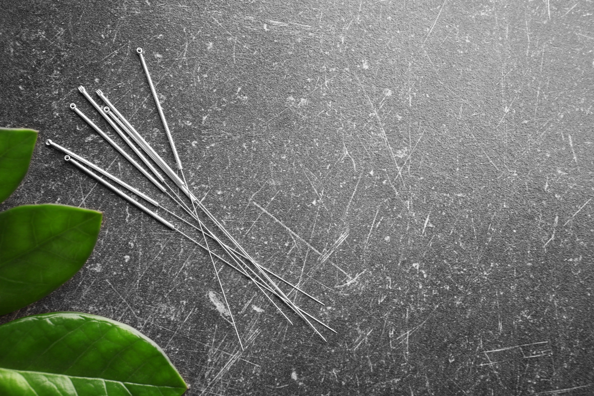 bigstock-Needles-for-acupuncture-on-dar-182383189.jpg