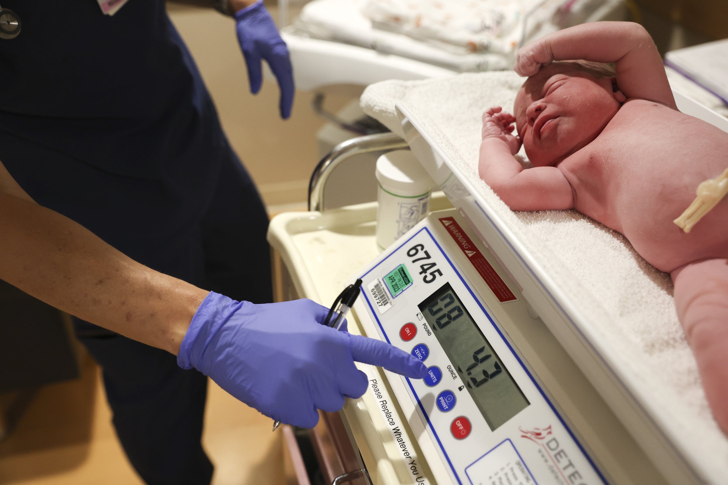  Newborn Yusuf Mohammadi lays on a scale while a nurse weighs him at Mercy San Juan Hospital on Thursday, May 12, 2022.After spending over an hour at the Sutter Hospital, the Mohammadi family was informed that there were no female doctors available t
