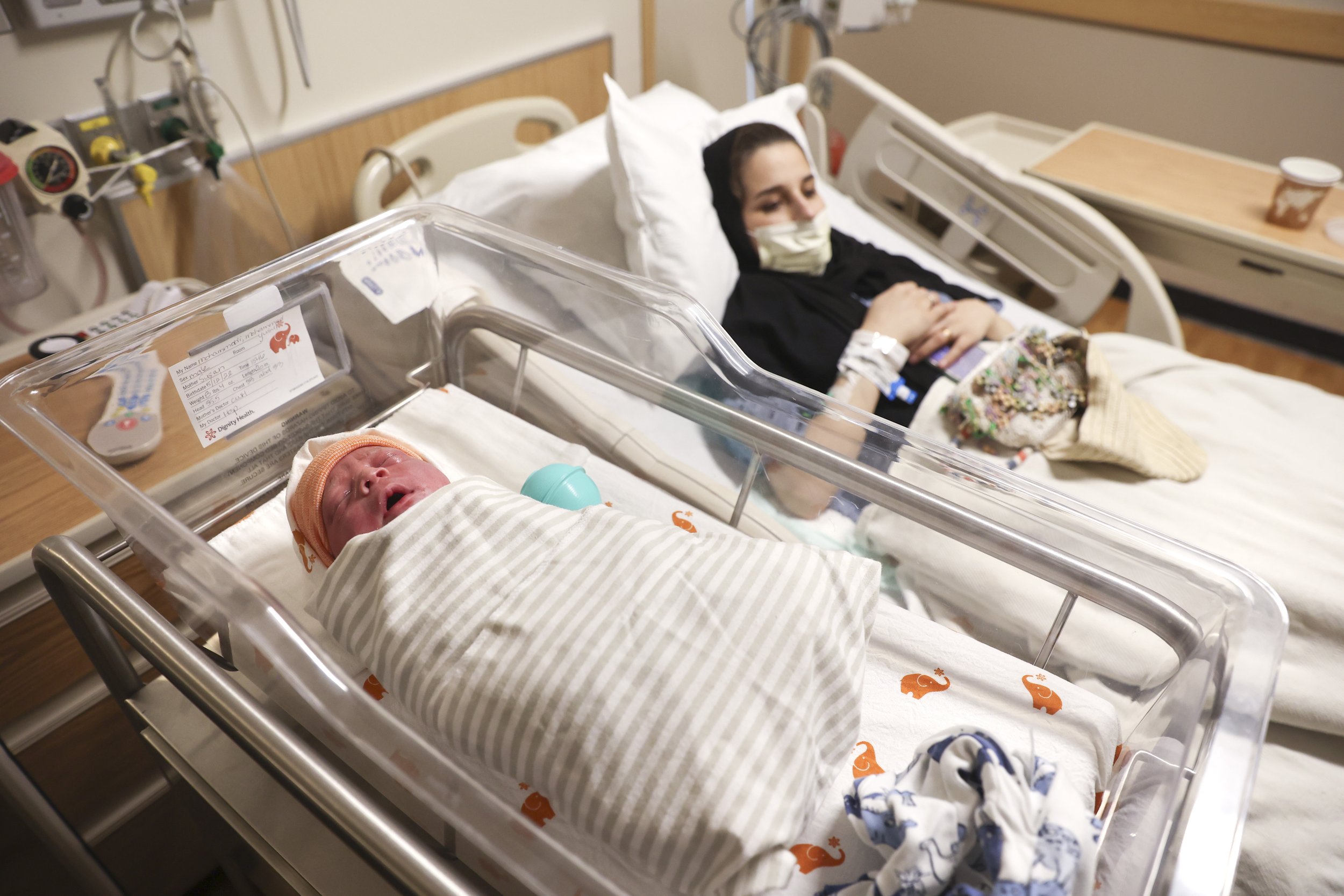  Newborn Yusuf Mohammadi and his mother Susan Mohammadi rest in bed at Mercy San Juan Hospital on Thursday, May 12, 2022. After spending over an hour at the Sutter Hospital, the Mohammadi family was informed that there were no female doctors availabl