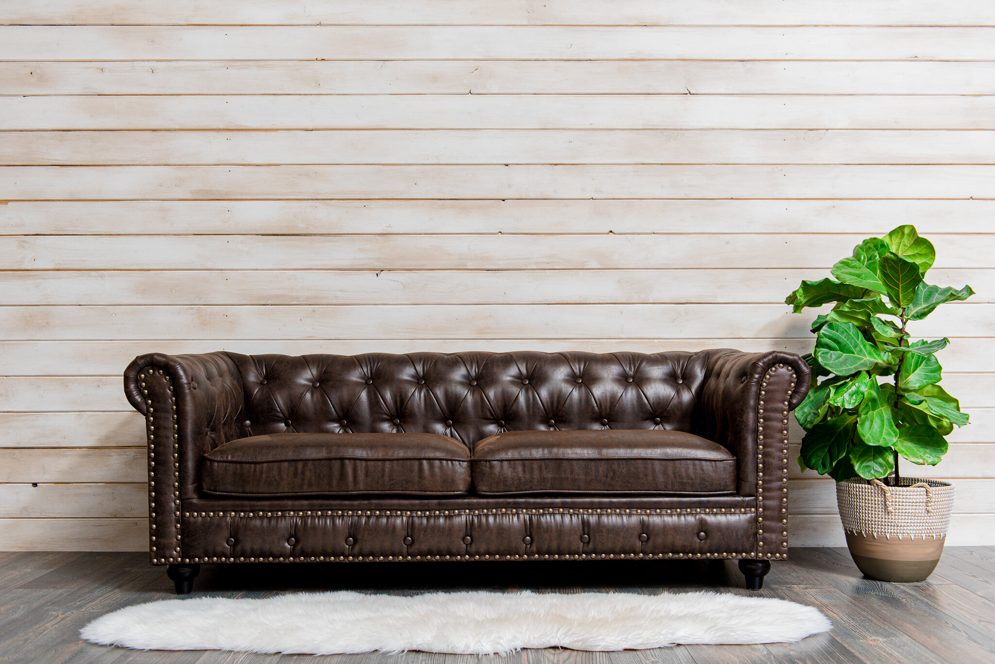 leather sofa and shiplap wall