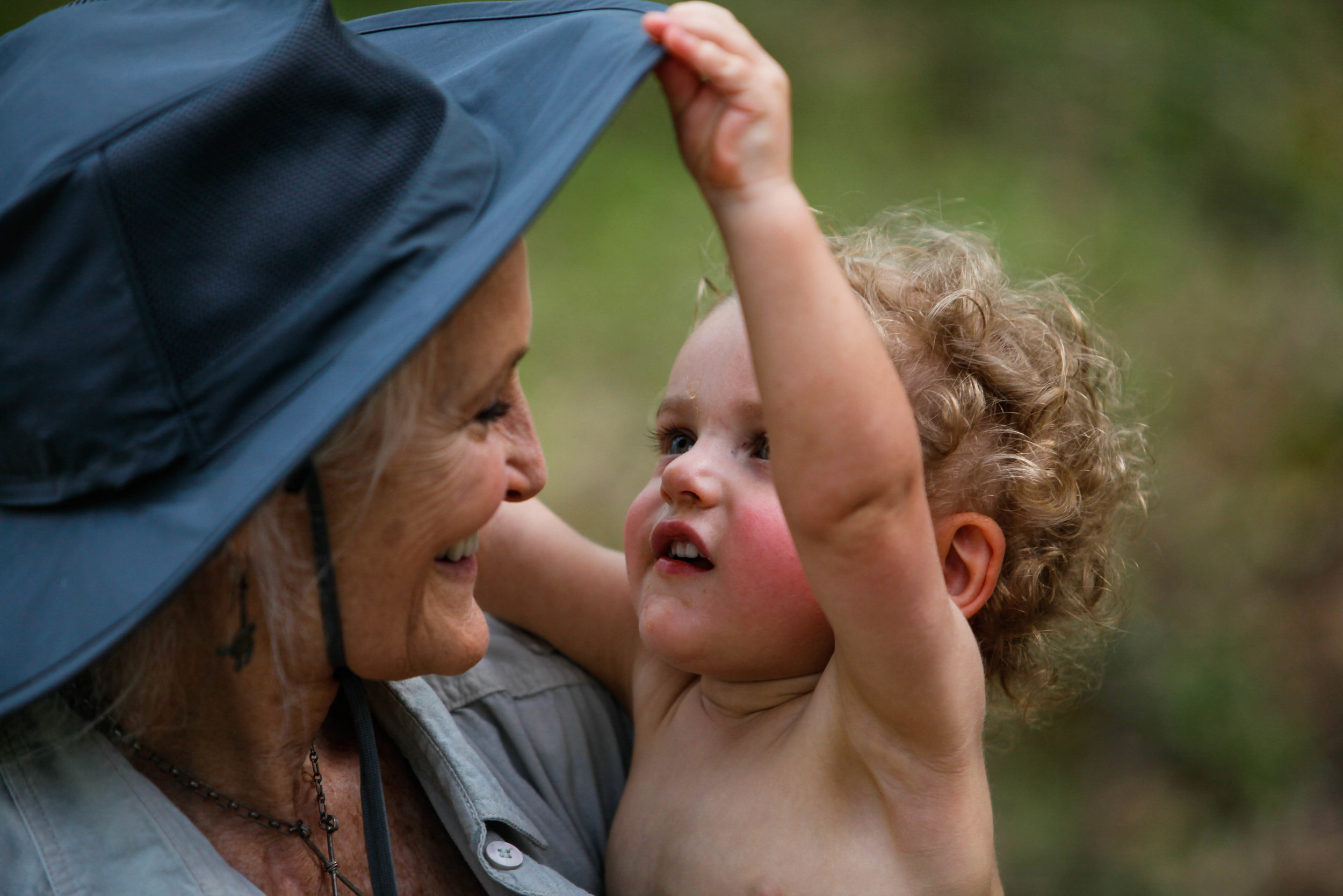  Tinsley smiles at her grandson at Earthsong on Saturday, April 14, 2018. She desires for Earthsong to be place where her grandchildren and future grandchildren can grow and explore and be free within the safety of its woods. 