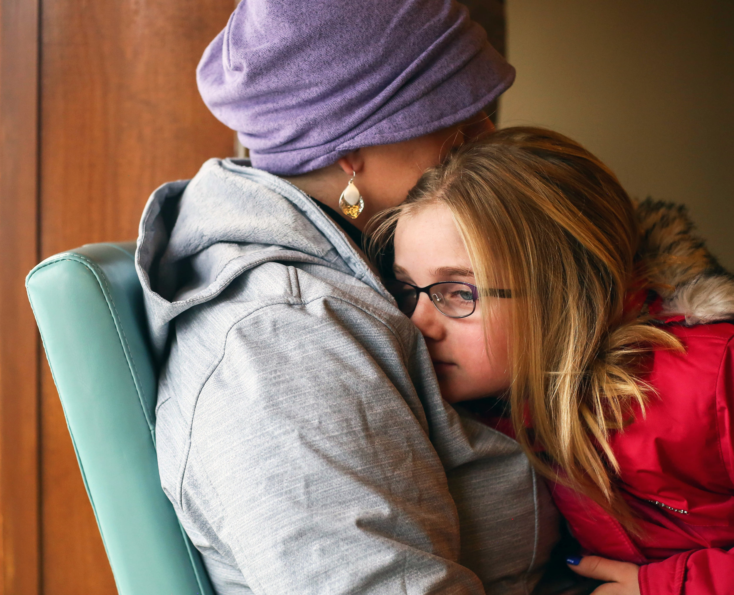  Amanda Cihak’s daughter Kayla leans into her while they wait to get her hair done at a salon, in Muskegon, Michigan on Saturday, Feb. 2, 2019. Amanda and her daughter share a strong bond. “We are very similar,” she said. “We’re both stubborn, perfec