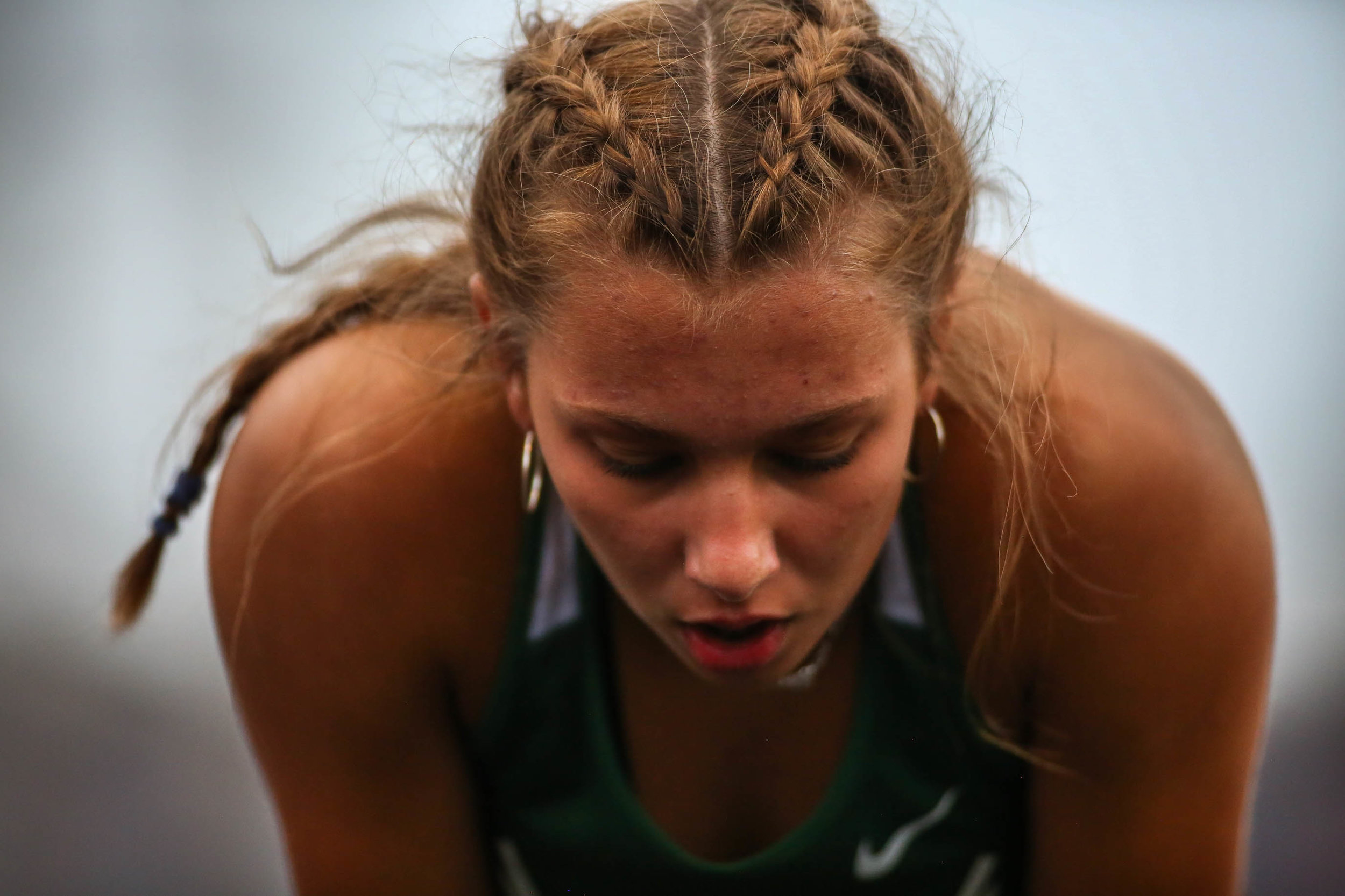 Reeths-Puffer senior Bridget McHugh catches her breath after the varsity girls 300-meters hurdles race during Friday's GMAA track and field meet at Fruitport High School in Fruitport, Michigan on May 3, 2019.