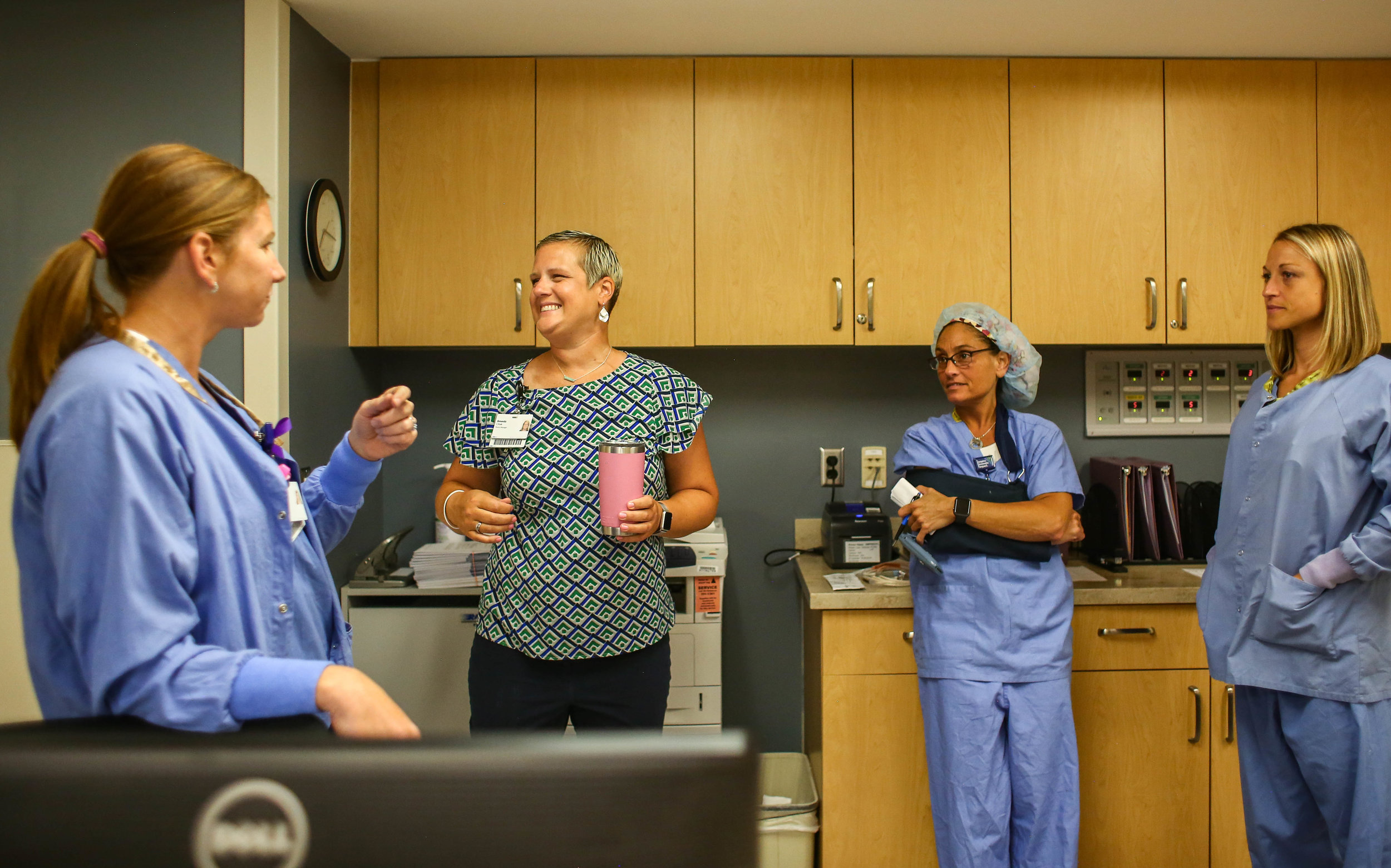  Amanda Cihak smiles as her co-workers welcome her back to work at Spectrum Health Gerber Memorial, in Fremont, Michigan on Monday, July 22, 2019. 