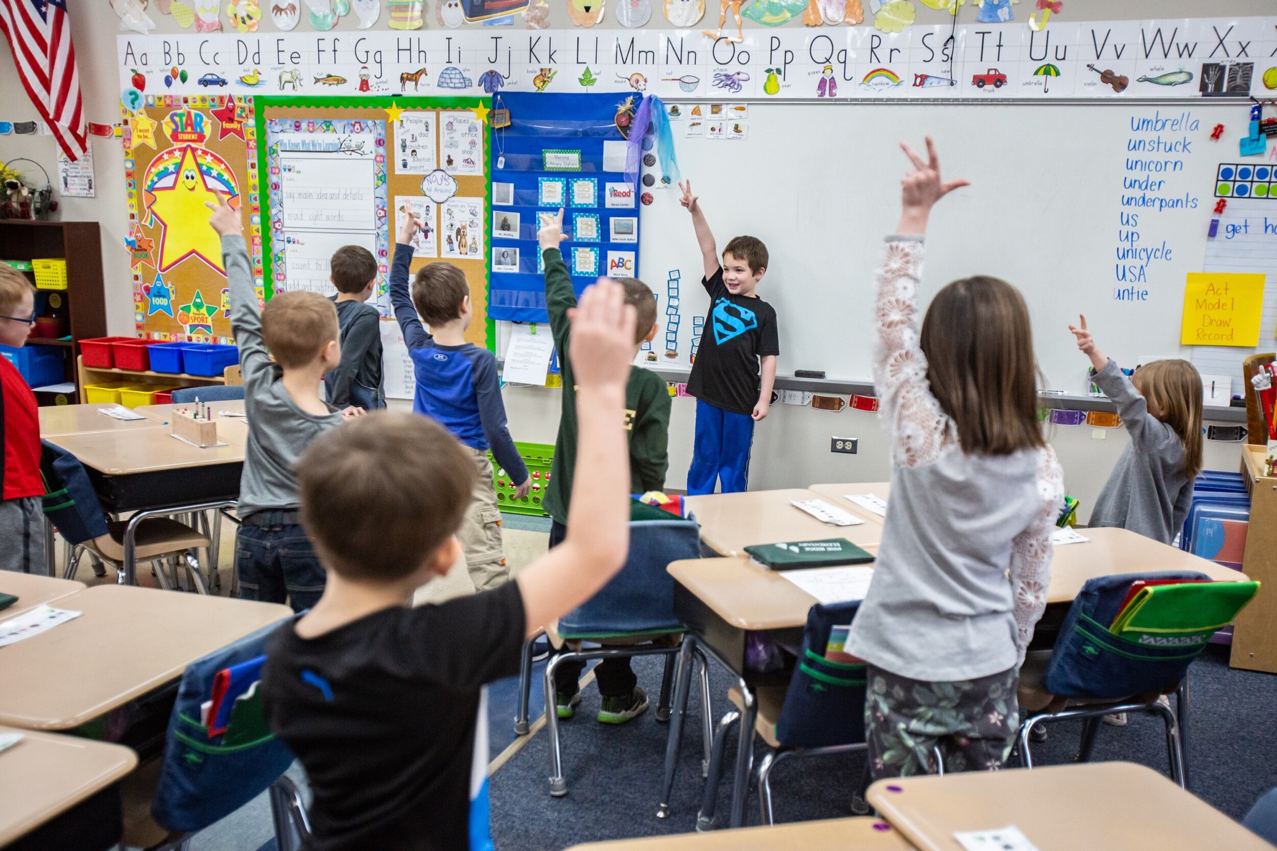  Pine Ridge Elementary kindergartener Coltyn Schultz, center, leads his classmates in an exercise activity to get some energy out at the school on Wednesday, February 12, 2020. 