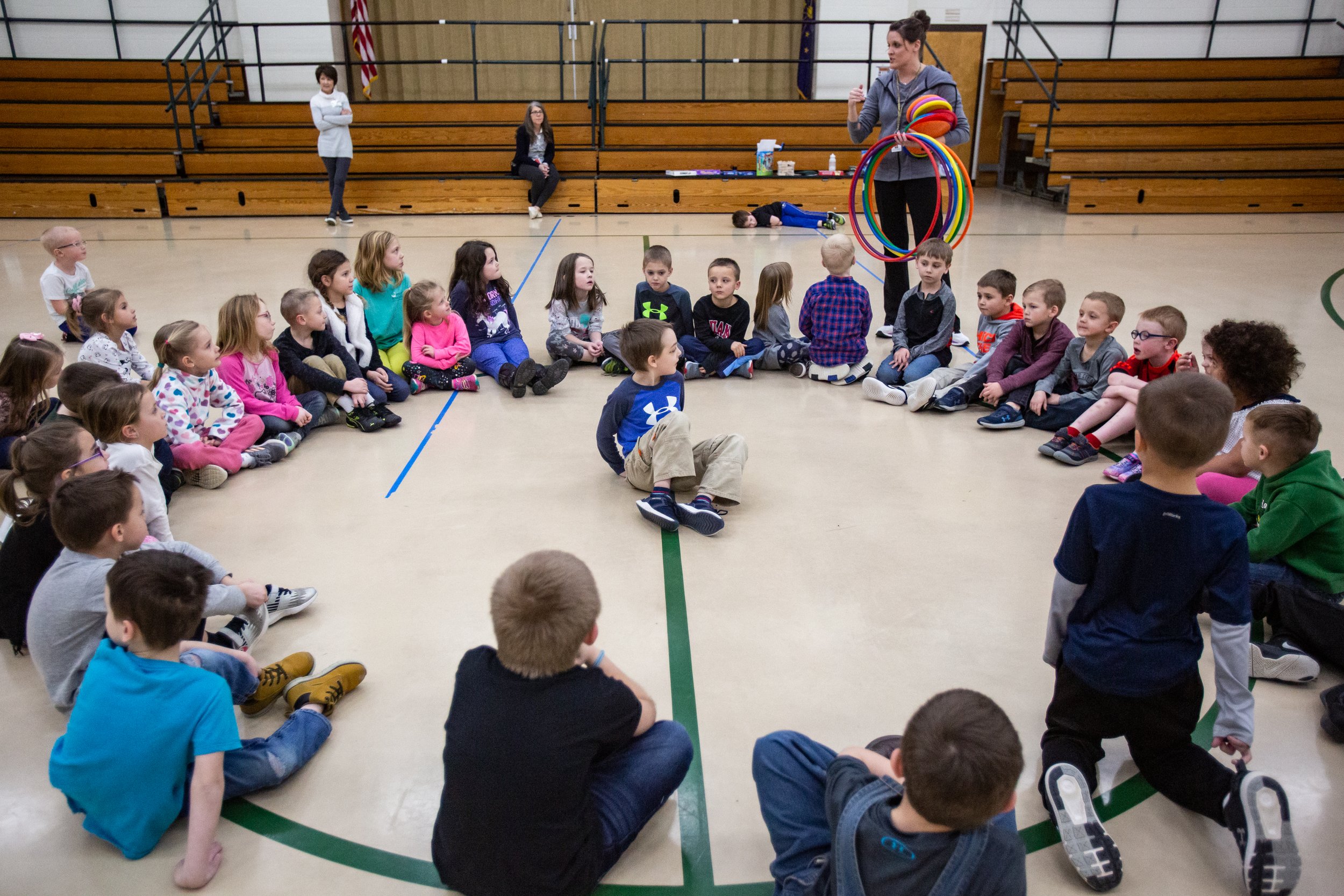  Kindergarten teacher Andi Longabaugh, top left, gathers the students together during gym class at Pine Ridge Elementary School on Wednesday, Feb. 12 2020. 