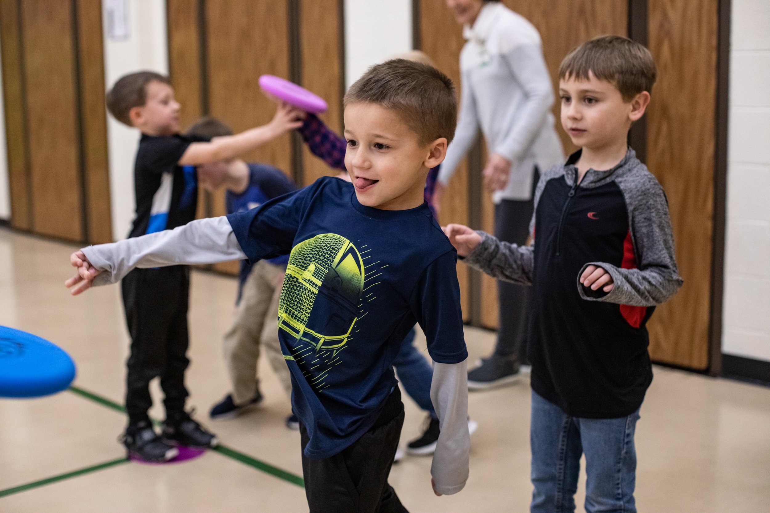  Kindergartner Owen Mohr throws a frisbee during gym class at Pine Ridge Elementary on Wednesday, Feb. 12 2020. 
