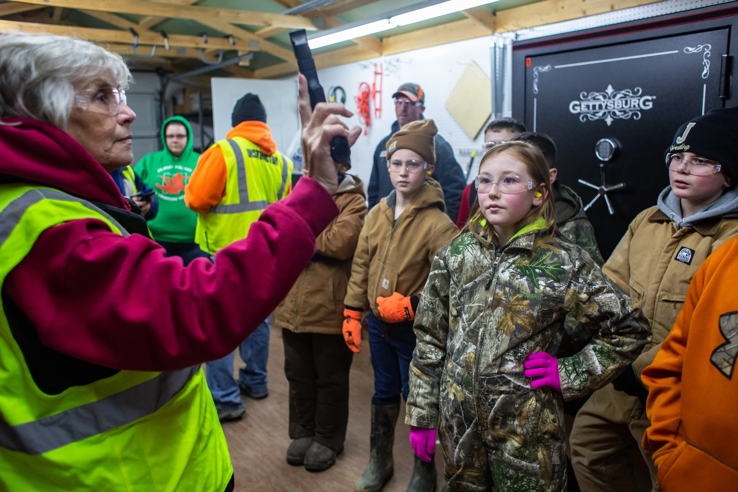  Bralyn Messmer, 10, of St. Anthony, the only girl in the Shooting Sports class, listens to instructor J.J. Frey of Lamar at the Dubois County 4-H fairgrounds in Bretzville, Indiana on Feb. 28, 2020. Messmer has been a club member for two years and p
