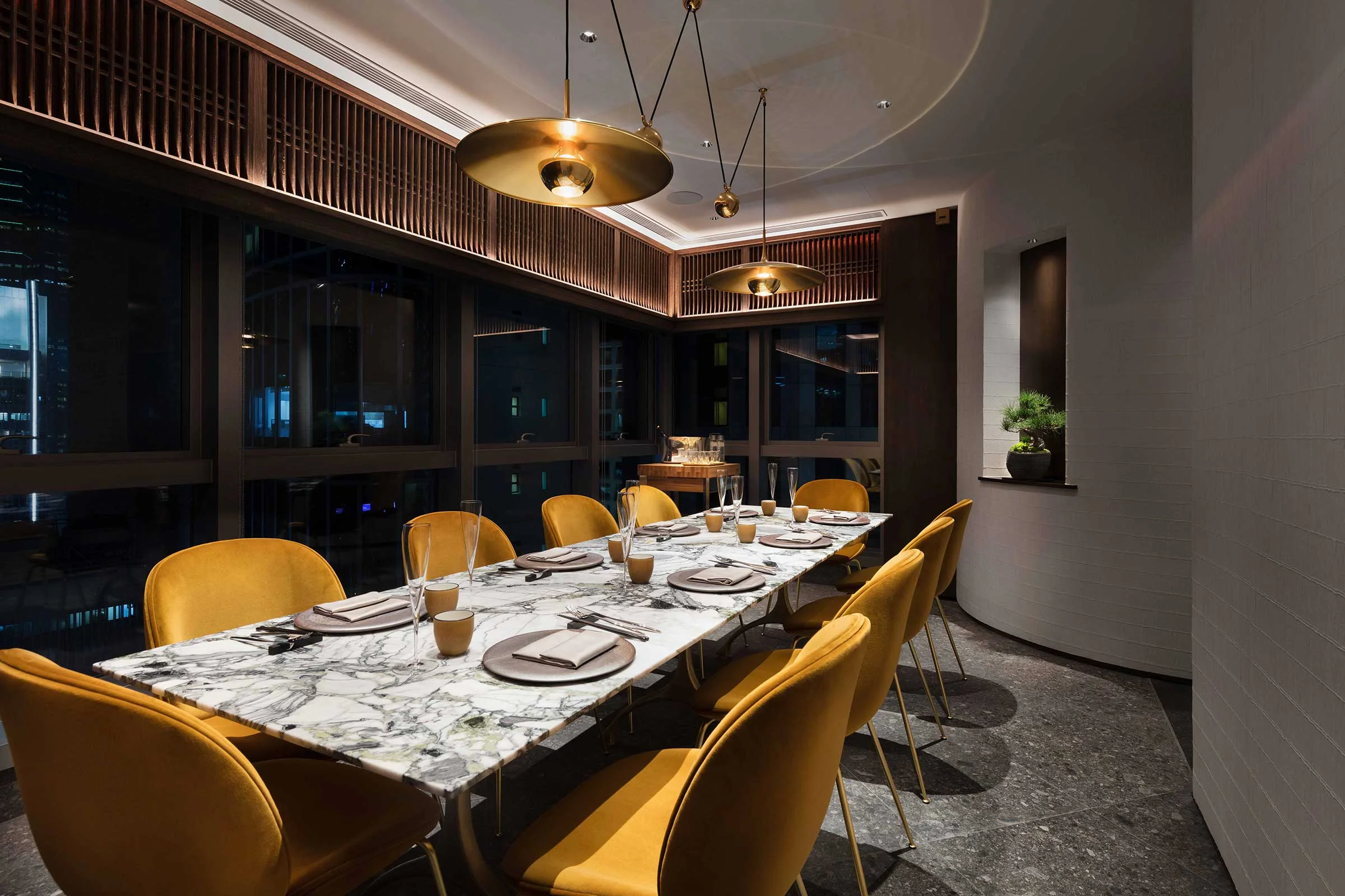 The large brass saucer in the private dining room is by Florian Schulz