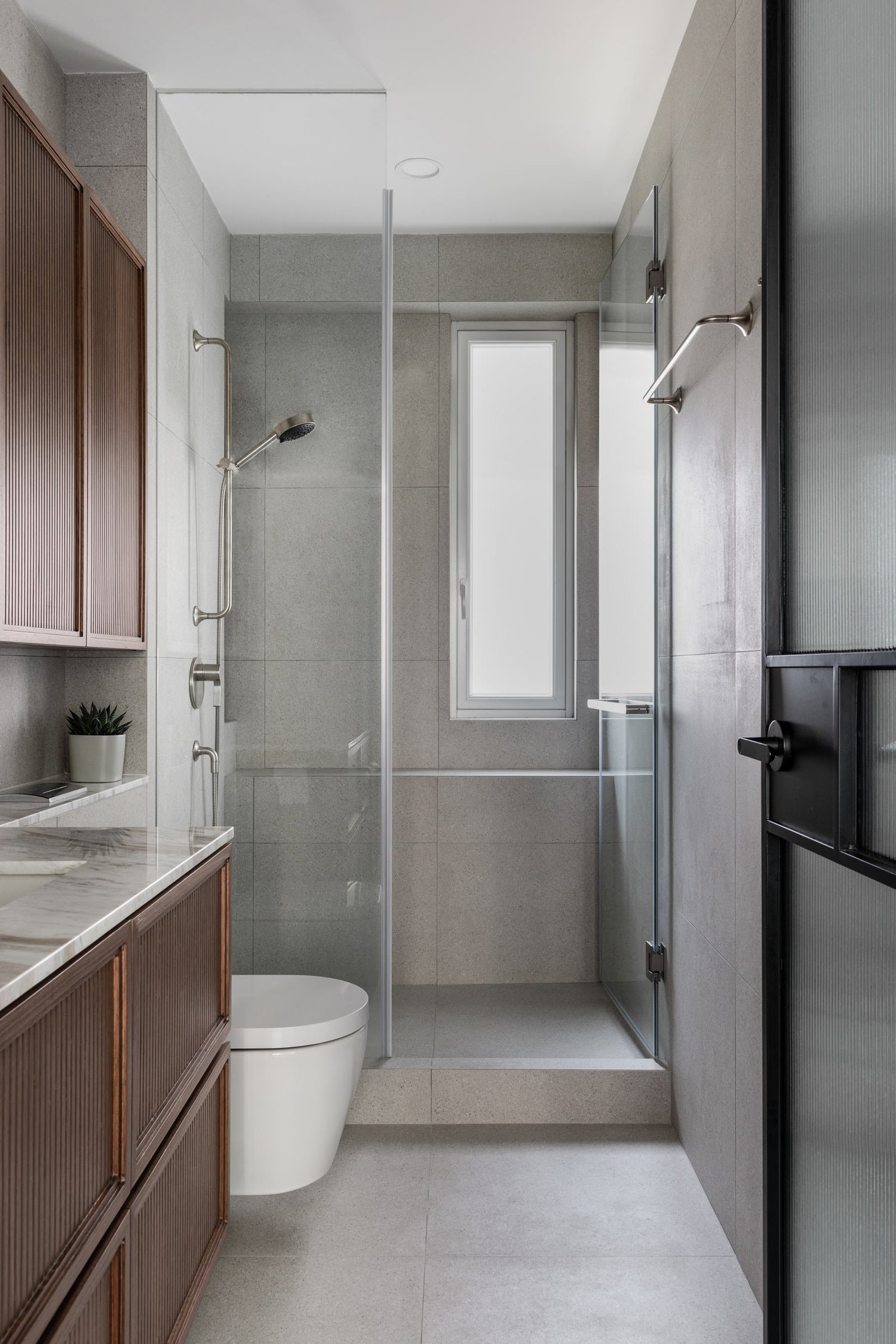 Image showcasing Shades of Green Define This Modern Family Apartment — Design Anthology