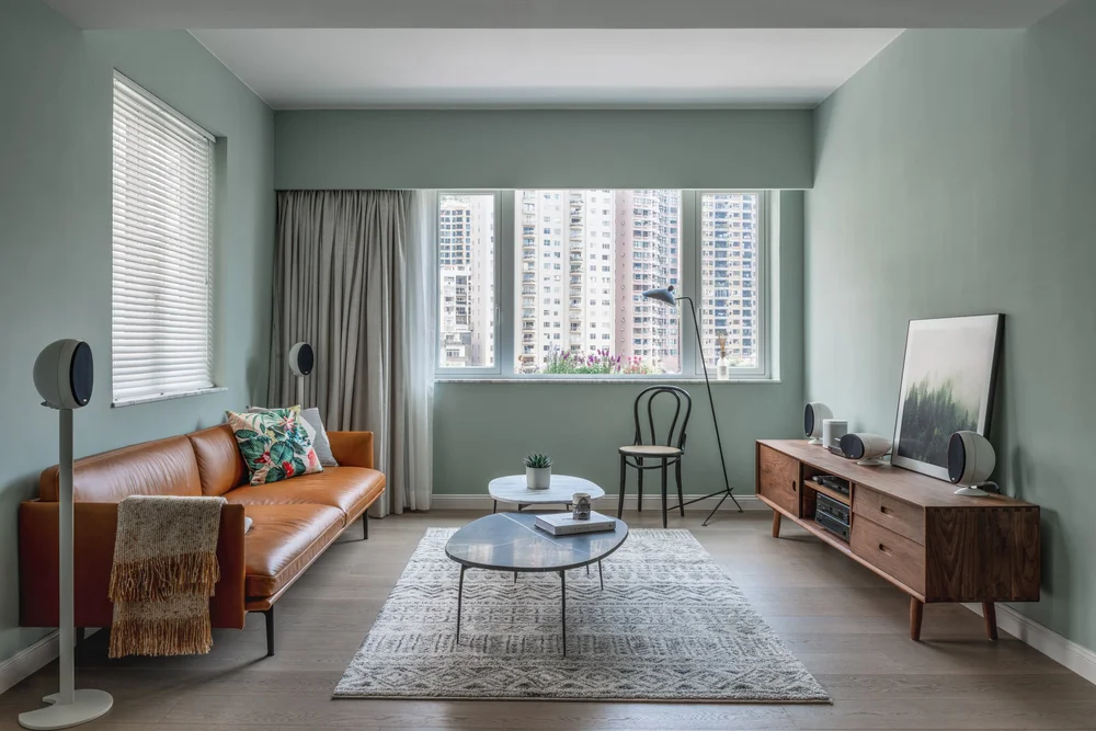Image showcasing Shades of Green Define This Modern Family Apartment — Design Anthology
