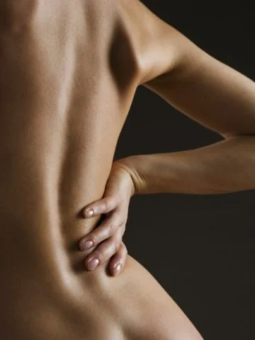 Woman holding her back_0.JPG