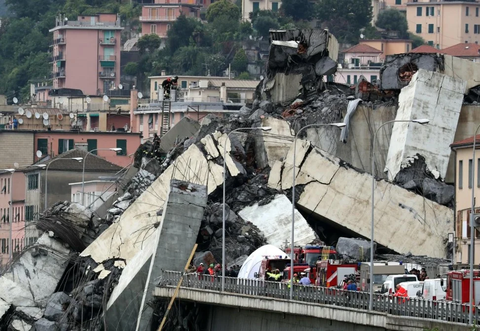 The collapsed Morandi Bridge is seen in the Italian port city of Genoa, Italy August 14, 2018. REUTERS/Stefano Rellandini