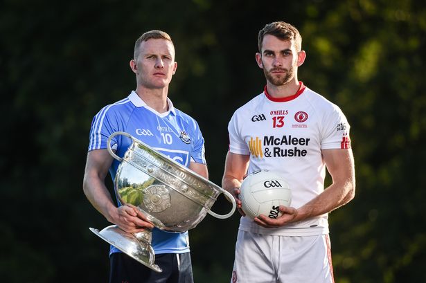 Ciarán Kilkenny of Dublin and Ronan McNamee of Tyrone with the Sam Maguire Cup (Image: Cody Glenn/Sportsfile)