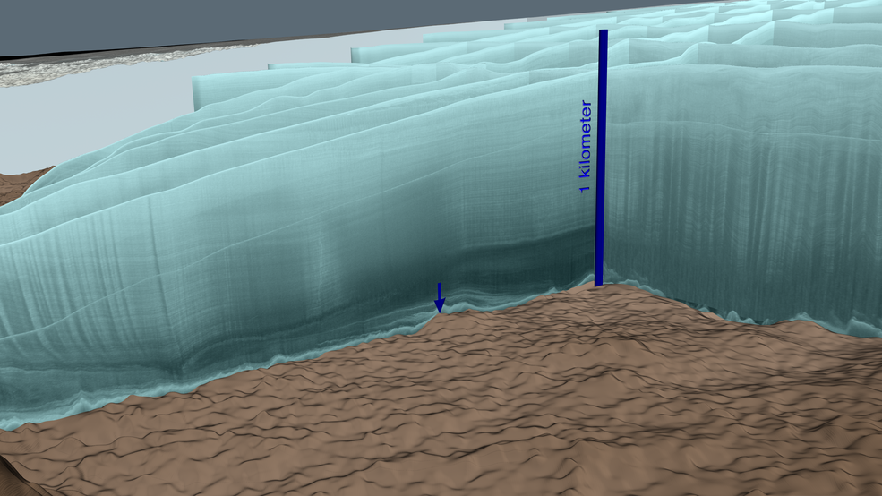 Radar data from an intensive aerial survey of the Hiawatha crater in May 2016 is shown here in aqua-colored curtains. A blue arrow points to the central peak of the crater. Credits: NASA/Cindy Starr