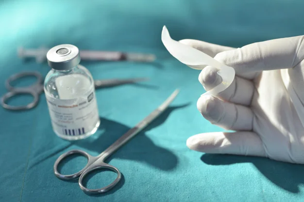 hand-holding-silicone-nasal-implant-operating-room-with-surgical-equipment_67340-58.jpg