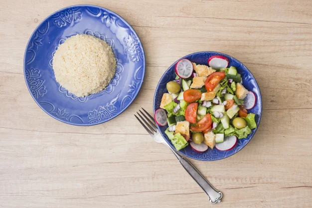 cooked-rice-with-vegetable-salad-wooden-table_23-2148080137.jpg