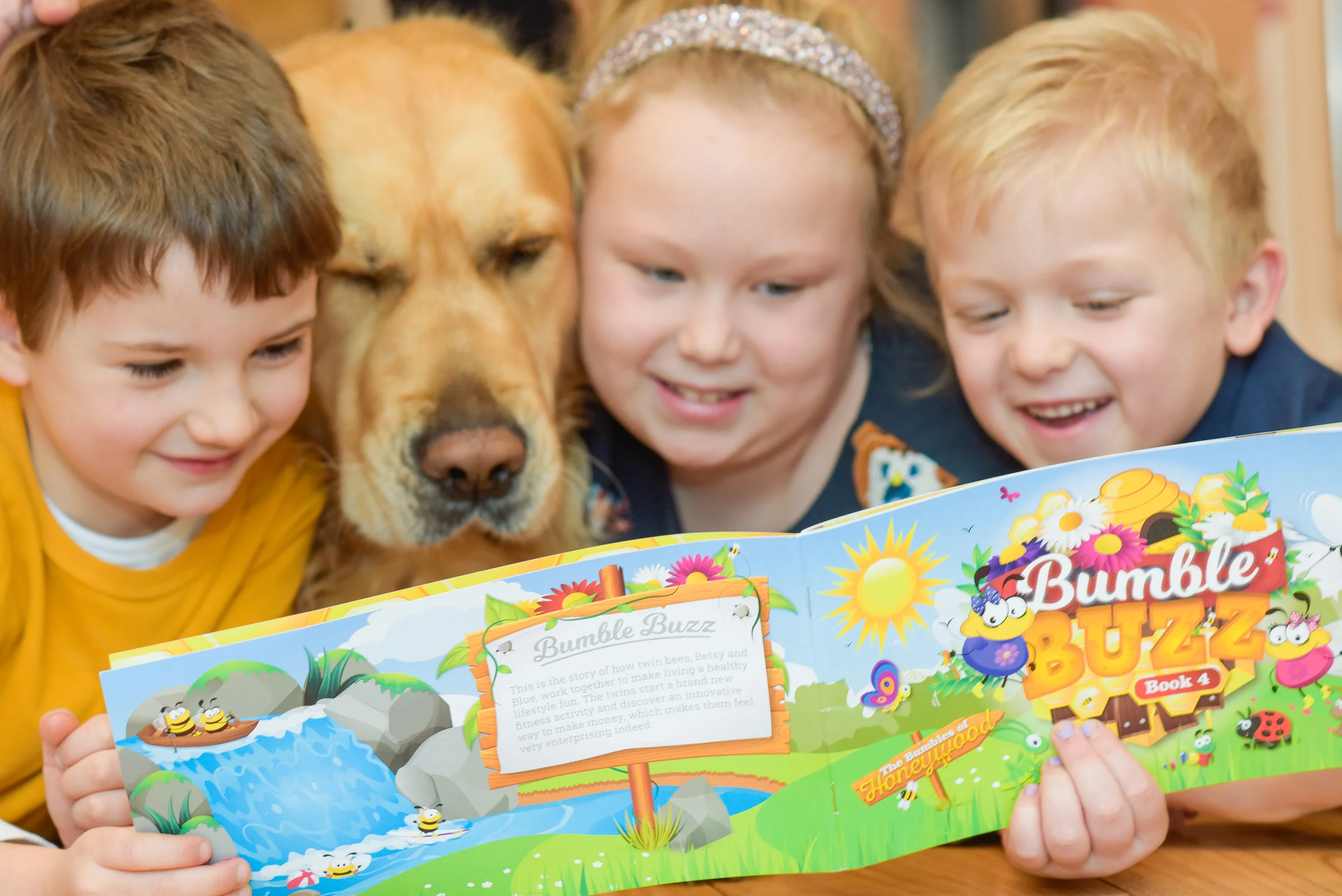 Sue's dog, Jack, can't resist getting in on the action while her grandchildren are reading the bumbles books