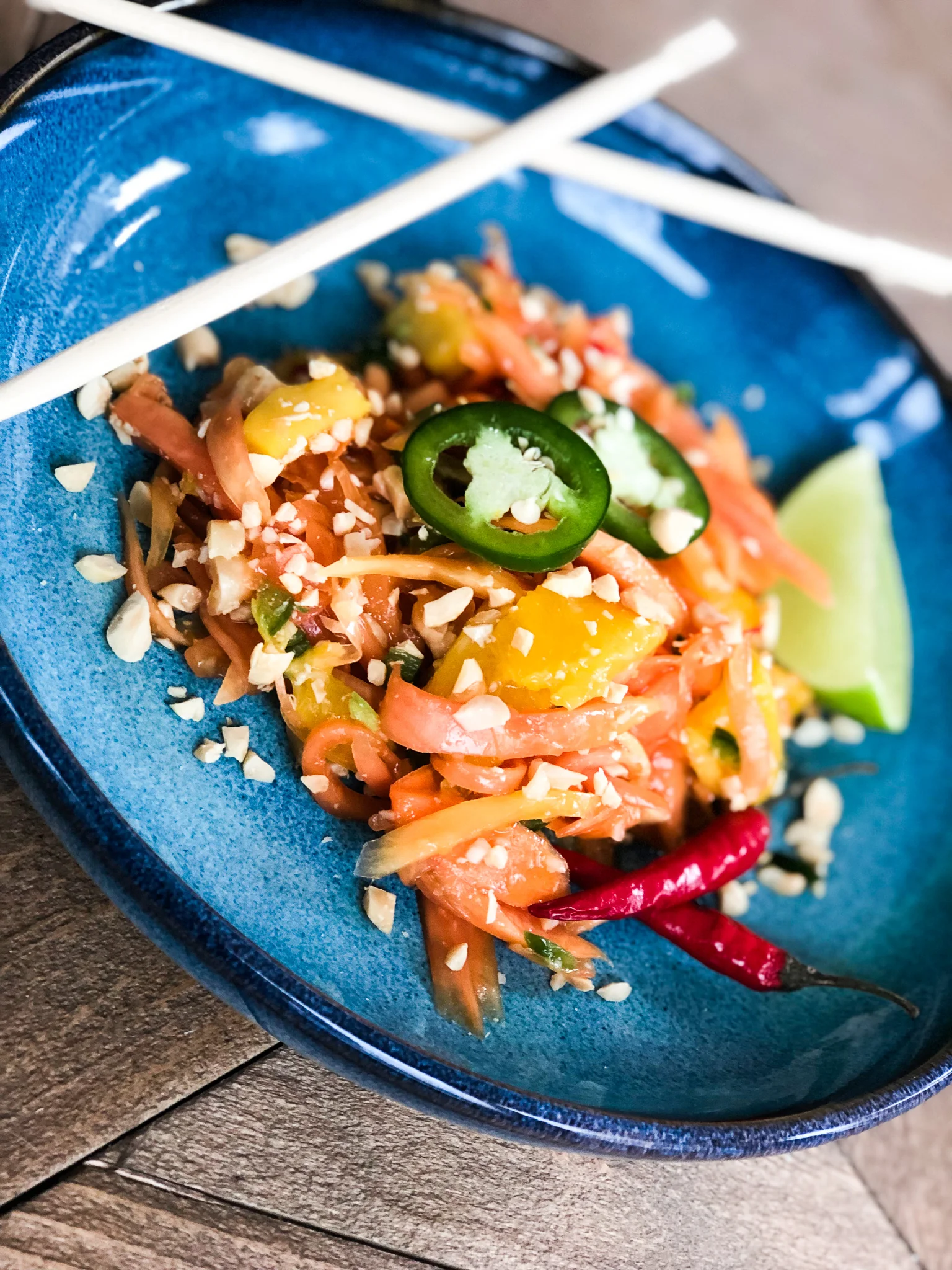 thai papaya salad with mango, jalapeño &amp; crushed peanuts