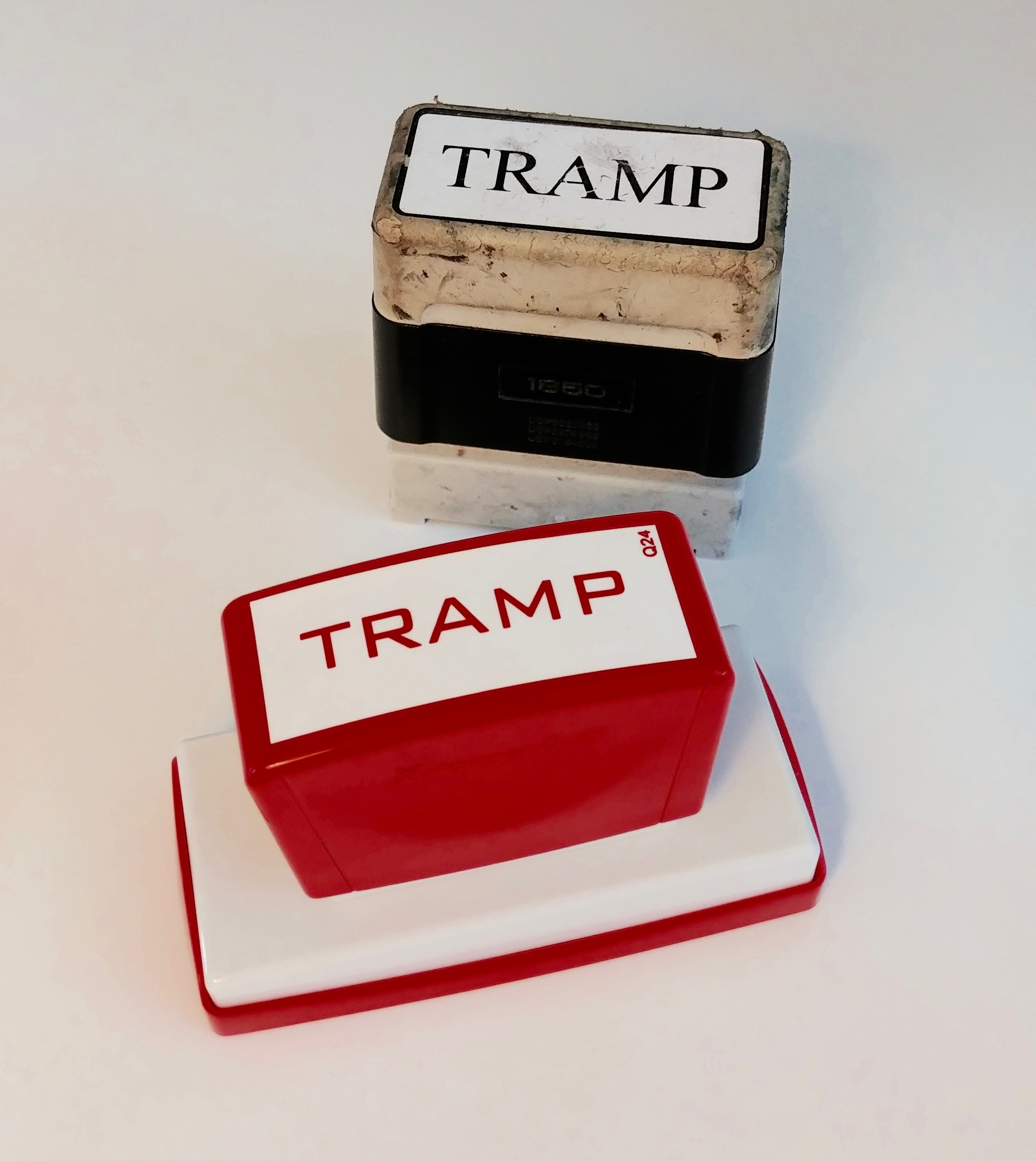 Tramp Stamp, 2013 Customized stamp from Staples, mixed-media Dimensions variable A "tramp stamp" is a pejorative colloquial term for a lower back tattoo, usually found on a female, and connotes promiscuity. Tramp is defined as: ( noun) 1 . a person who travels from place to place on foot in search of work or as a vagrant or beggar. 2 . the sound of heavy steps, typically of several people. From Wikipedia: Tramp: more commonly a slang term for a loose woman in both American and British English; a slut Perhaps because female tramps were often regarded as prostitutes, the term tramp came to be used to refer to a promiscuous woman. This is largely an Americanism and not in global usage.