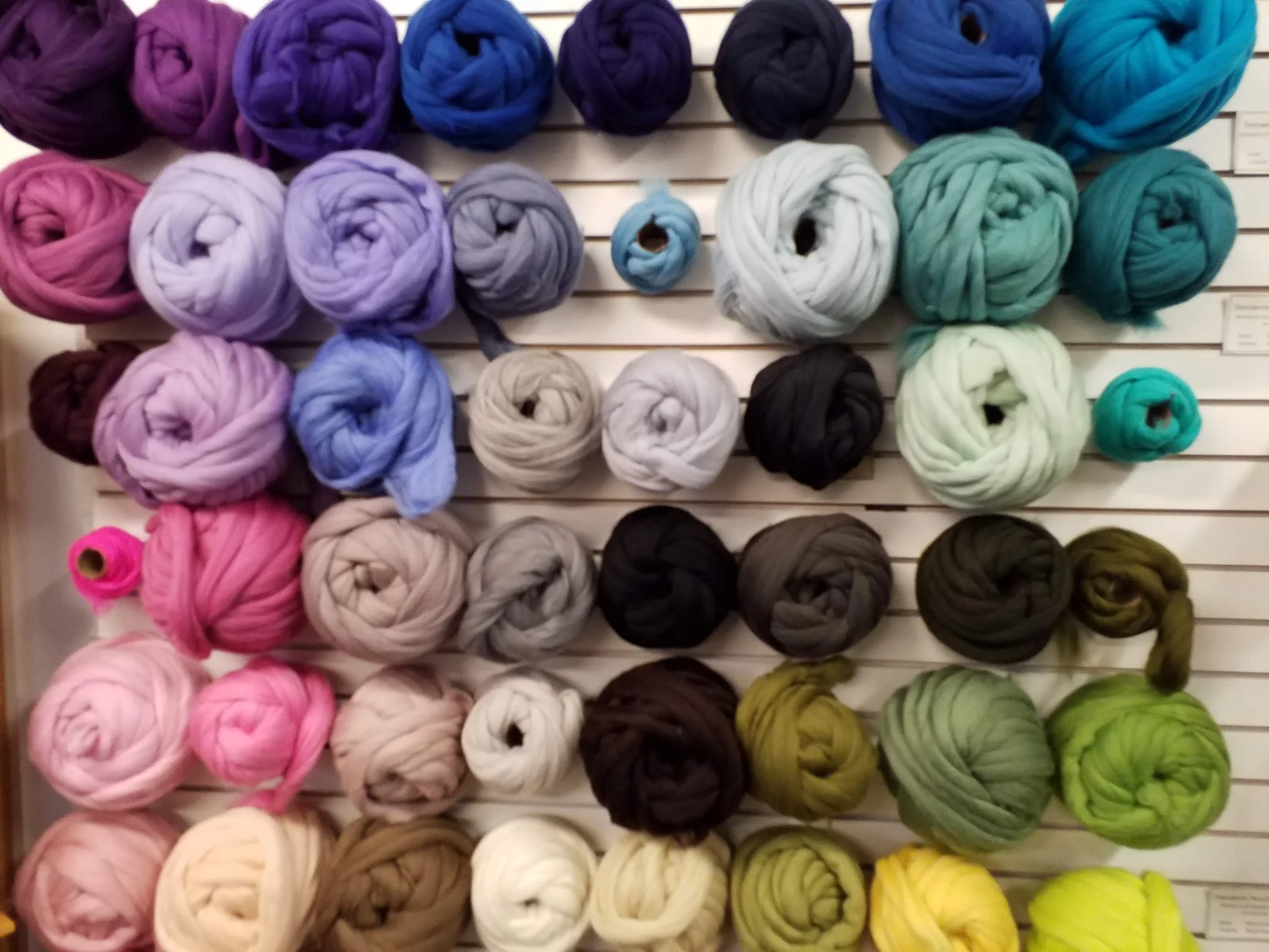 Hand dyed wool ready to be spun. A rainbow of options.