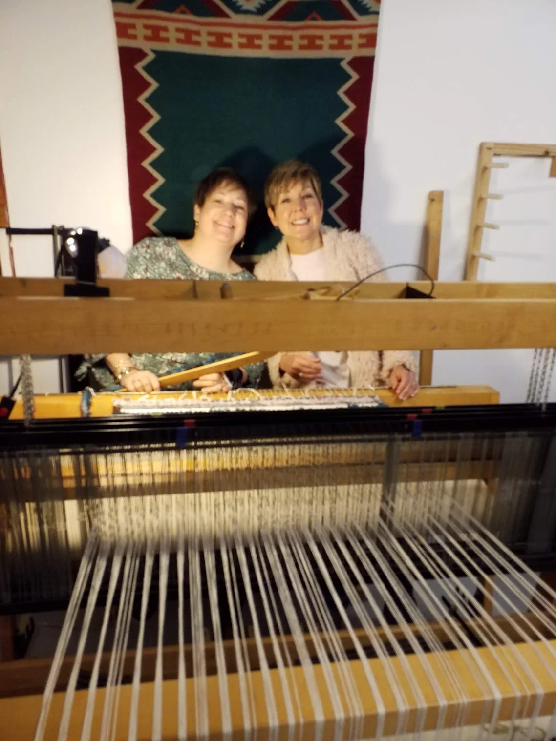 Having way too much fun with Renee Rucci of Renee Rucci Design. I am holding a shuttle to weave the weft threads through.