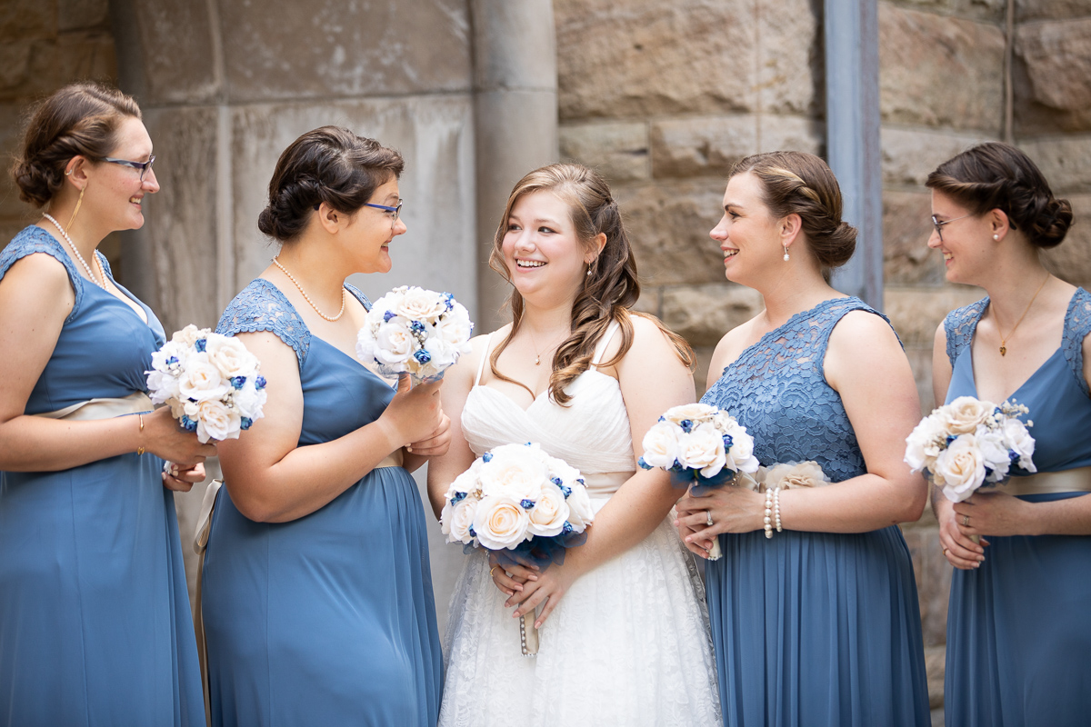 Bride and bridesmaids laughing