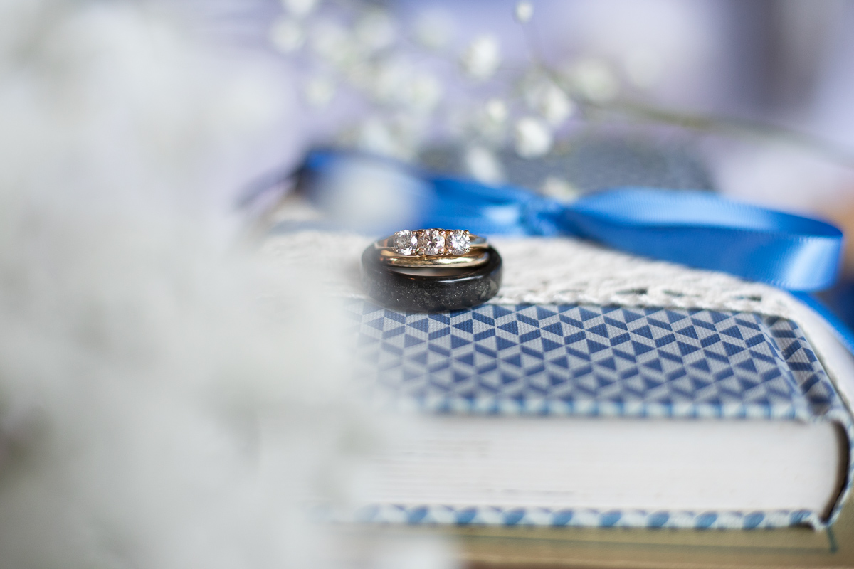 Wedding rings on books. 