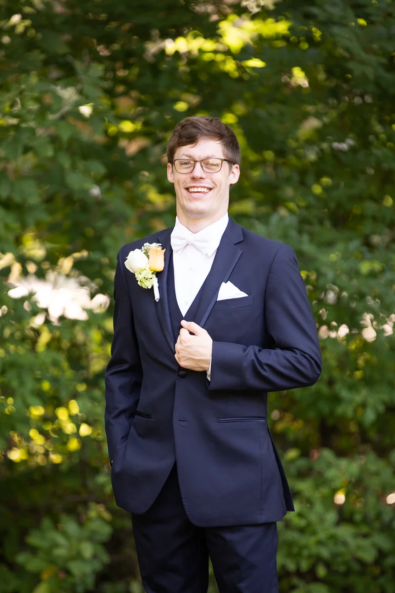Groom smiling during formals. 