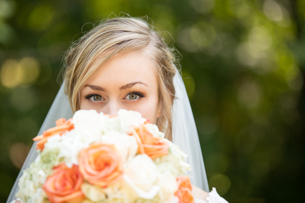 Bride holding bouquet during bridal formal photos. 