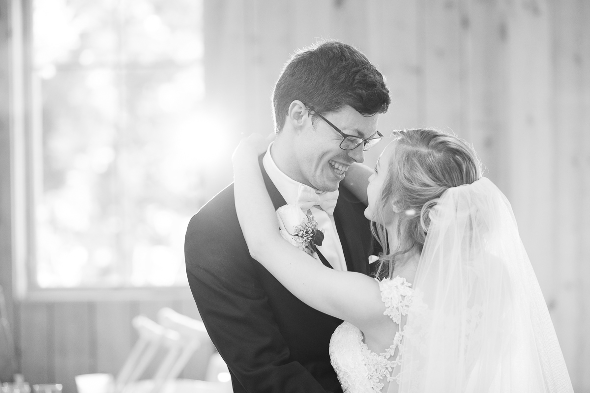 Black and white photo of bride and groom's first dance. 